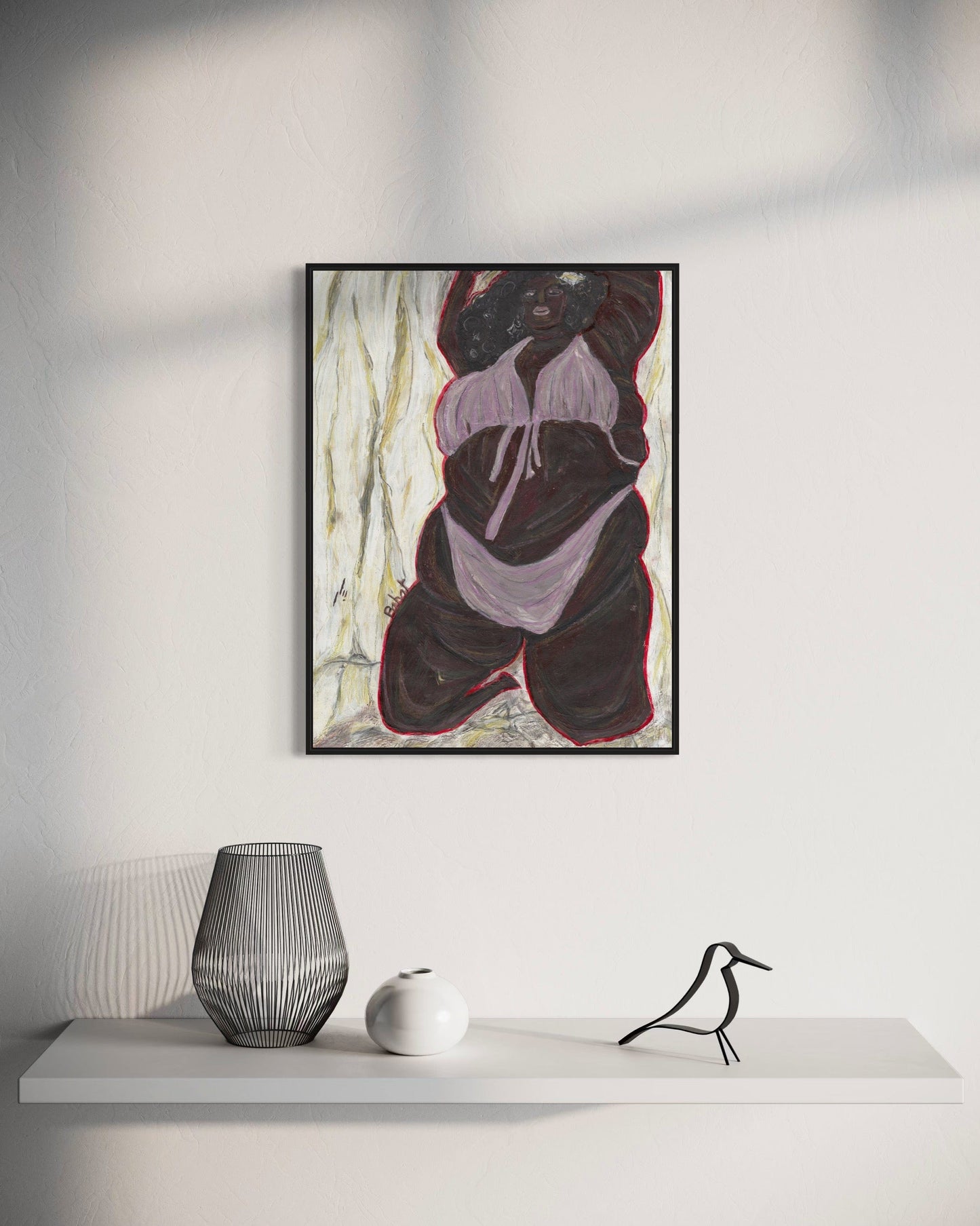 Abstract art piece on a wall above a white shelf with decorative items.