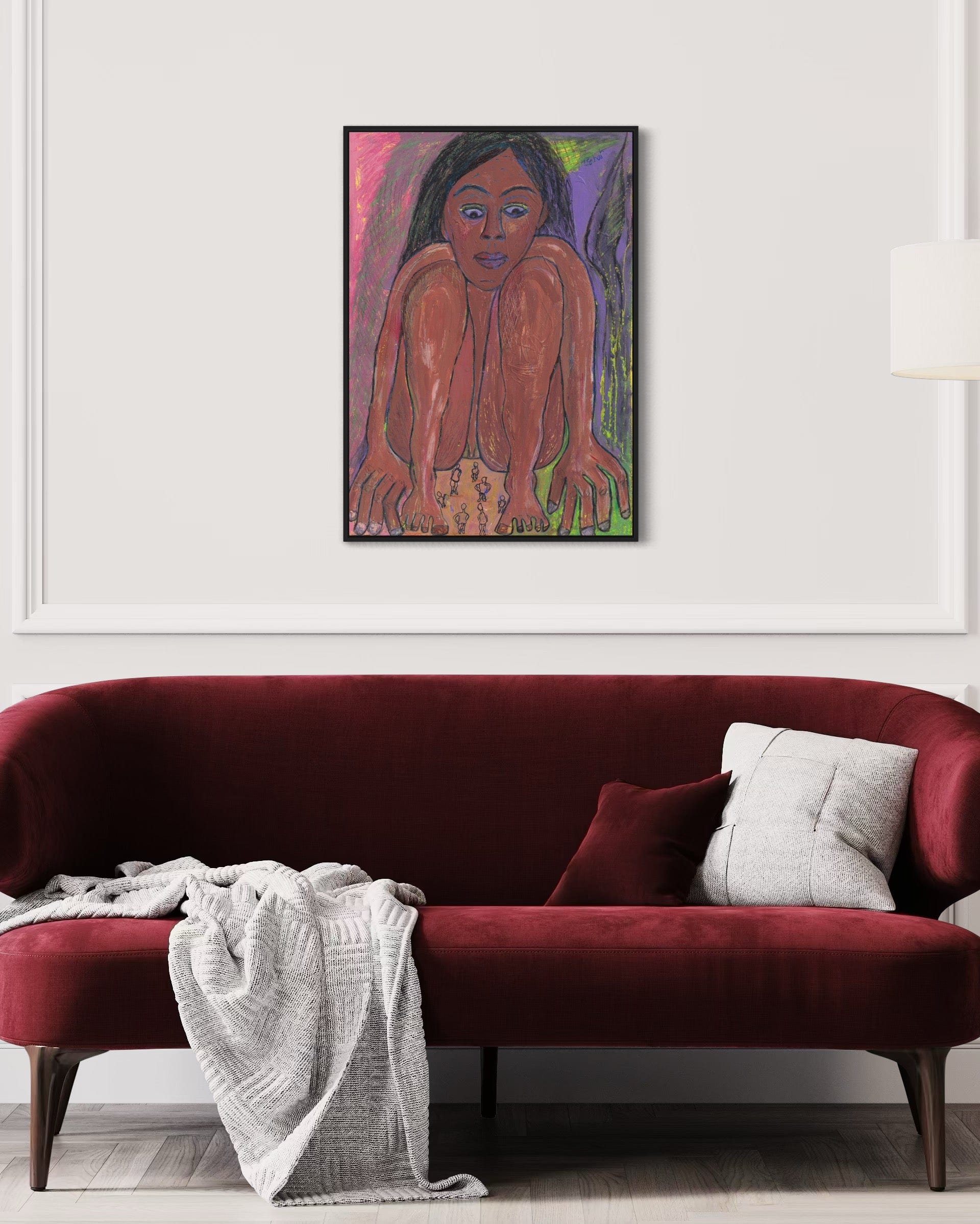 Colorful abstract painting of a woman on a white wall above a red sofa.