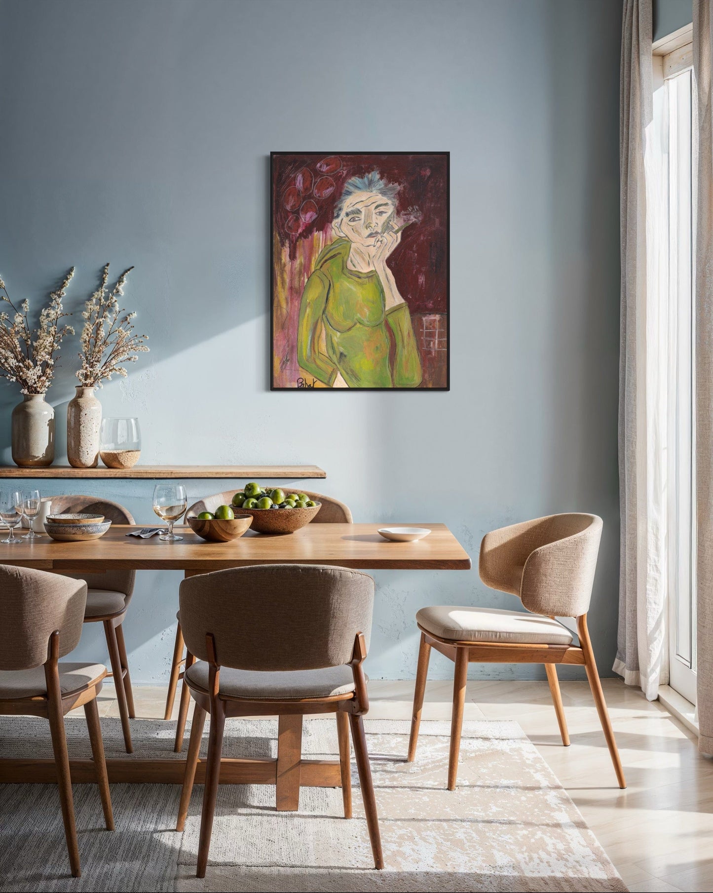 Dining room with wooden table and chairs, artwork on the wall, and natural light.