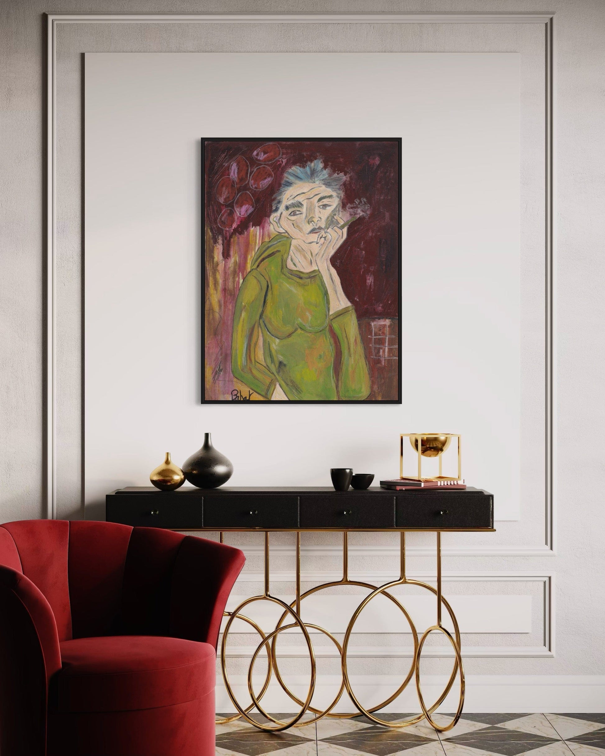 Modern interior with a red armchair, gold console table, and framed artwork on a white wall.