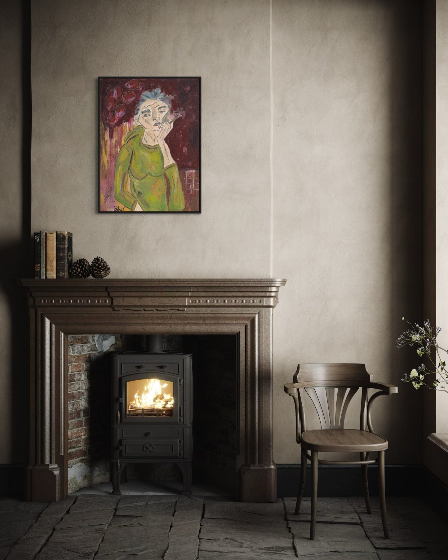 Room interior with a fireplace, chair, and framed artwork on the wall.