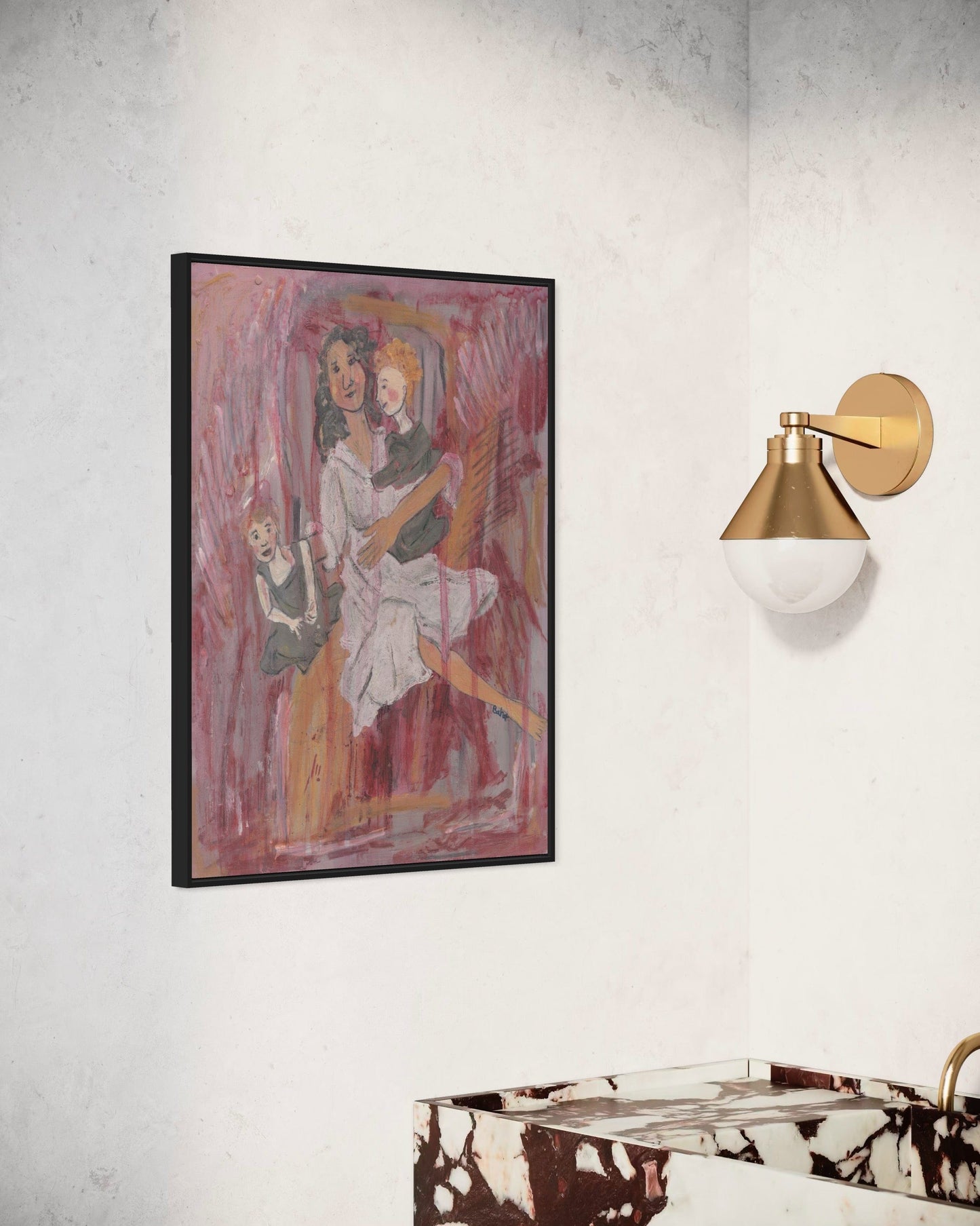 Framed abstract artwork on a wall with a gold sconce.