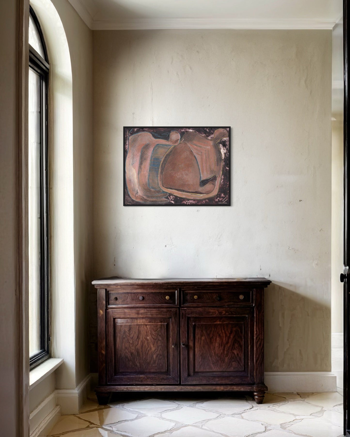 Wooden cabinet against a wall with abstract art above it
