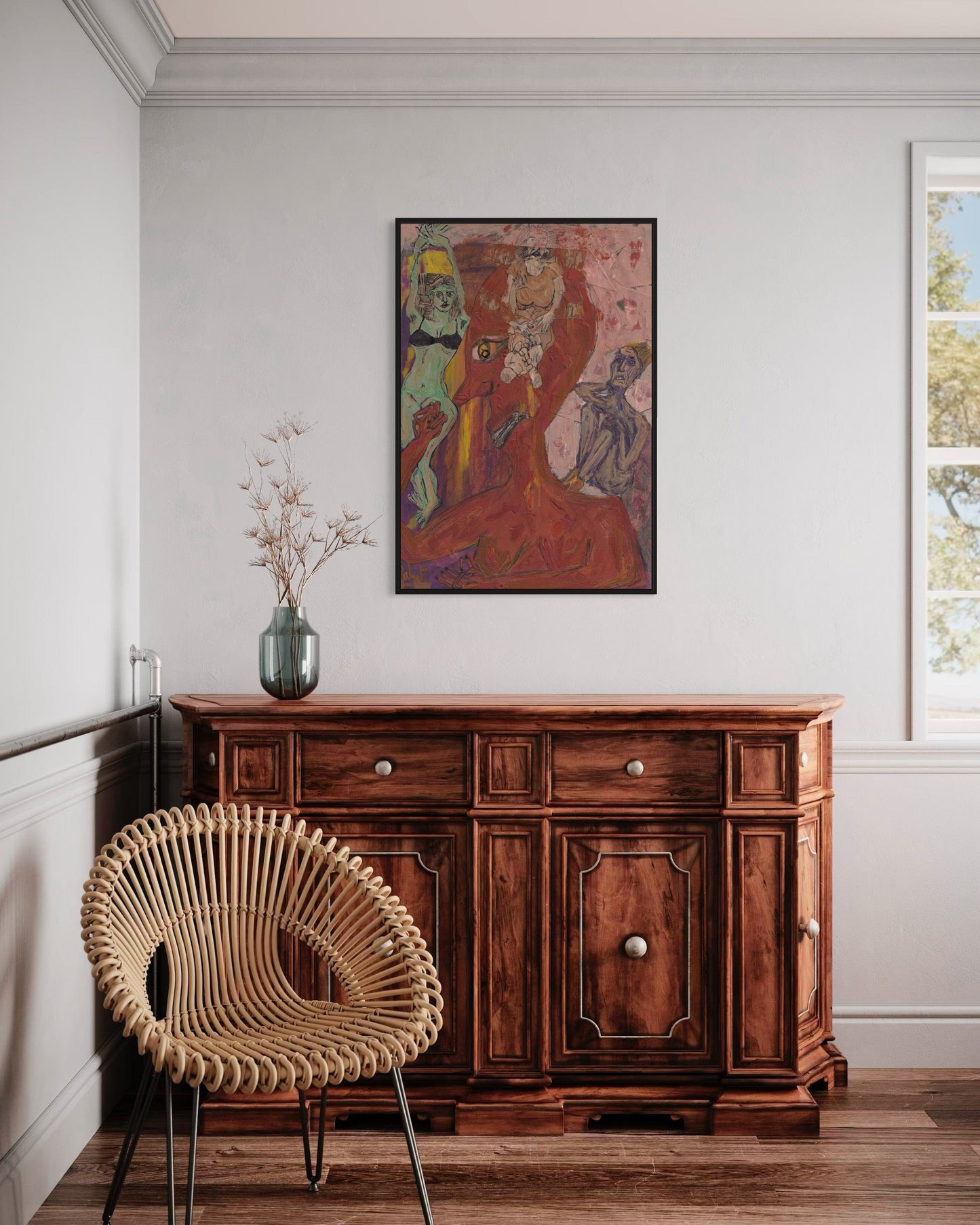 Wooden sideboard with a wicker chair and abstract painting in a room.