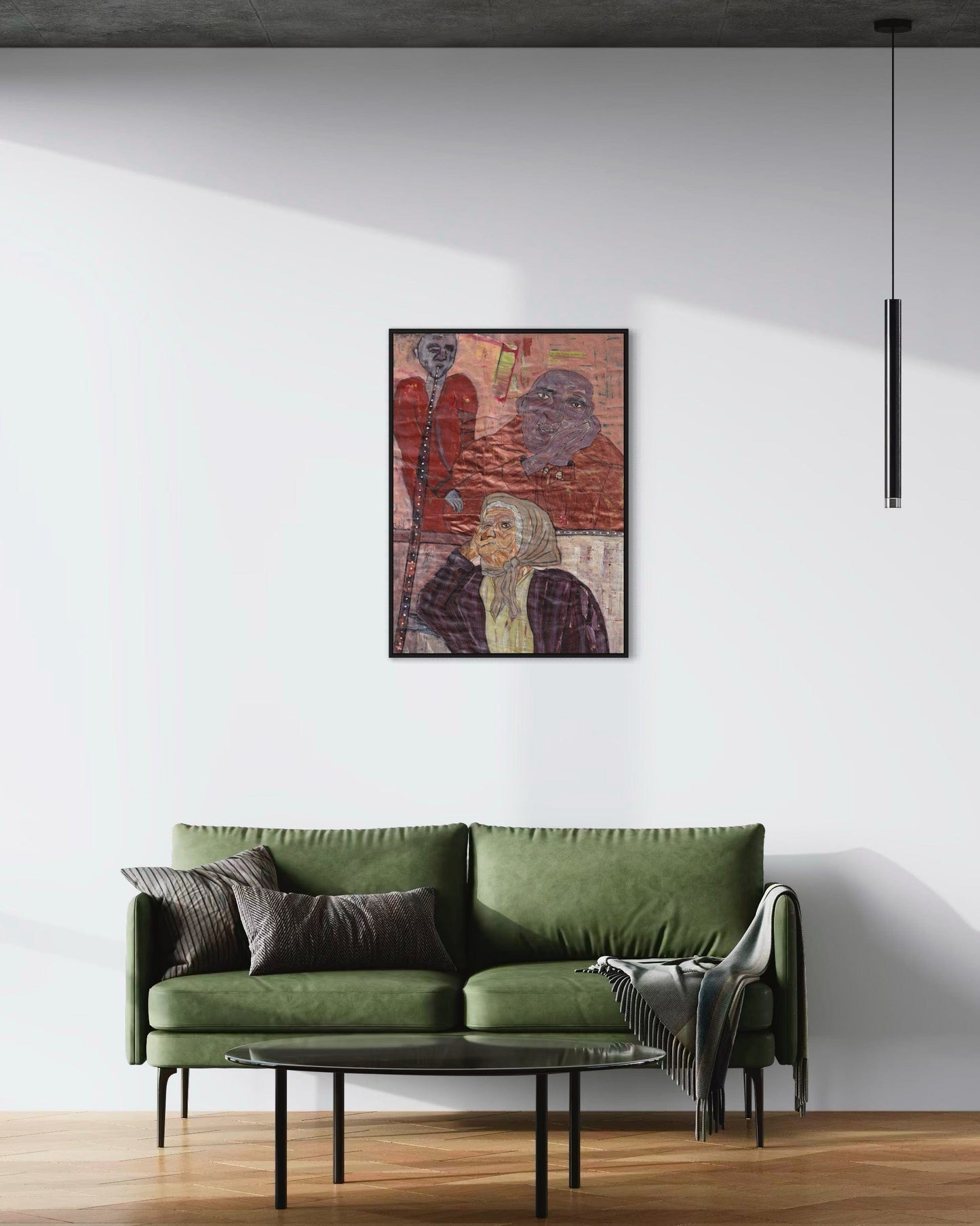 Green sofa in a living room with a colorful abstract painting on the wall.