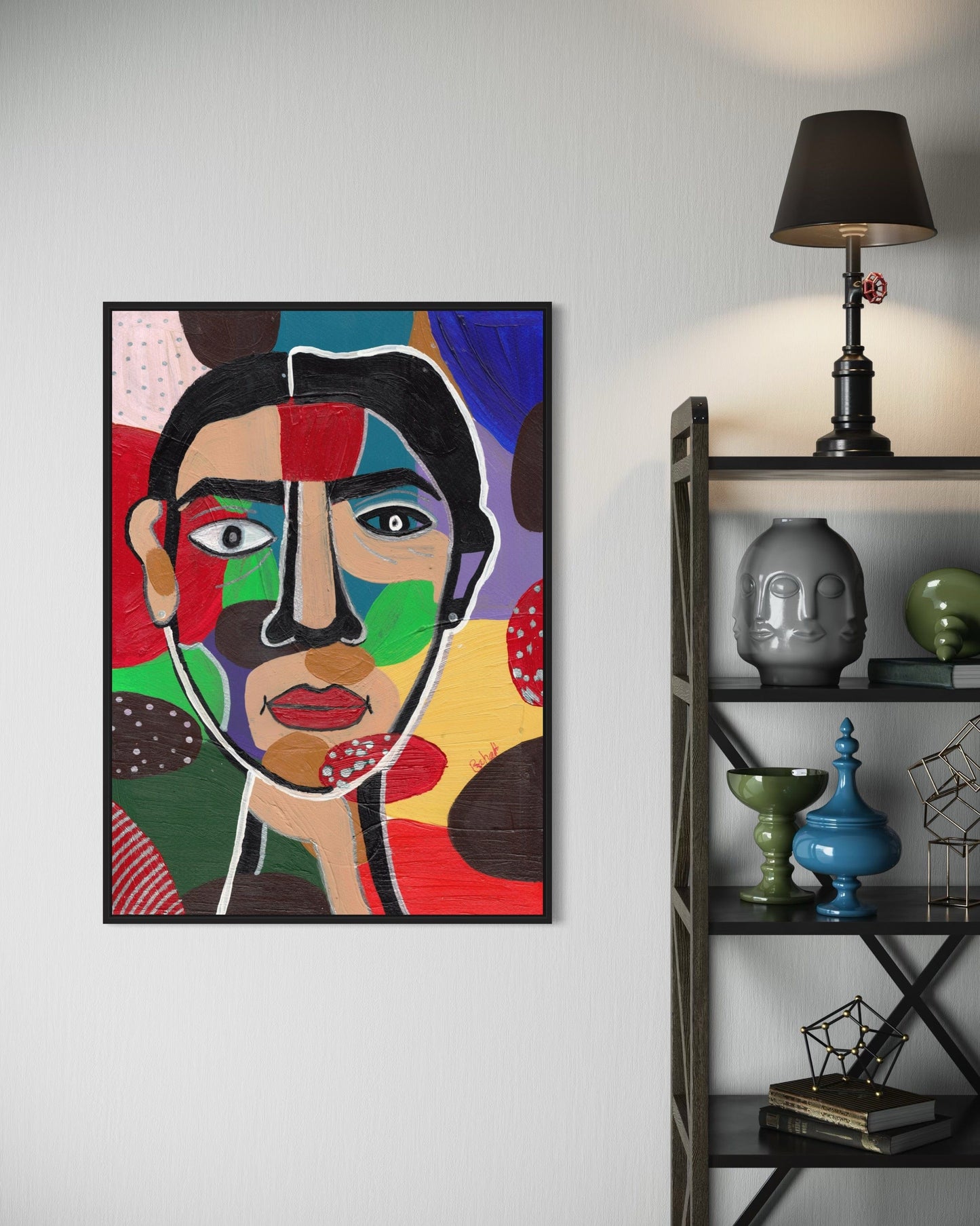 Colorful abstract art piece on a wall next to a shelf with decorative items.