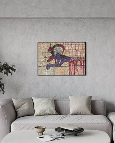 Abstract painting on a wall above a gray sofa in a living room.