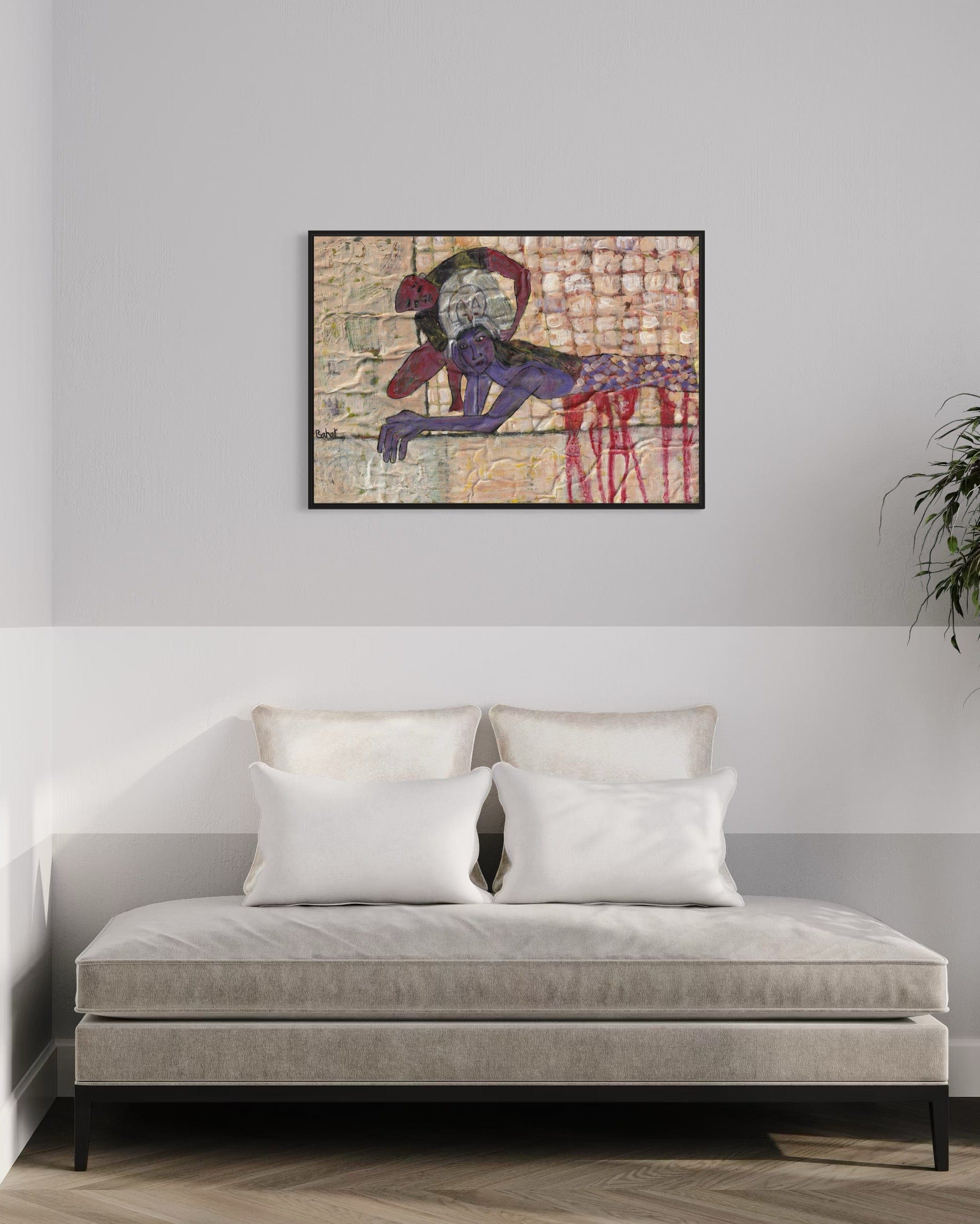 Abstract painting above a sofa in a living room setting