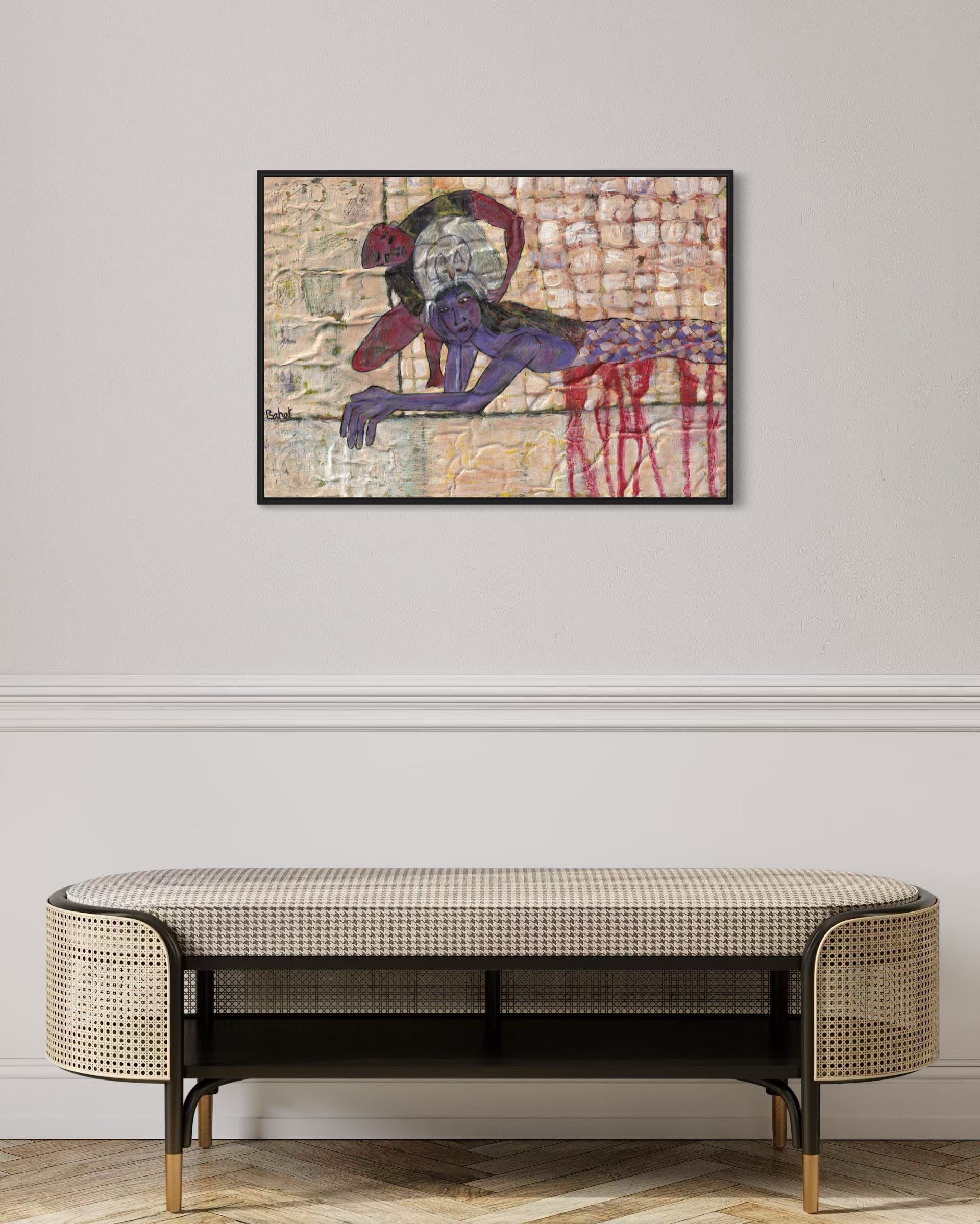 Framed abstract artwork on a wall above a bench