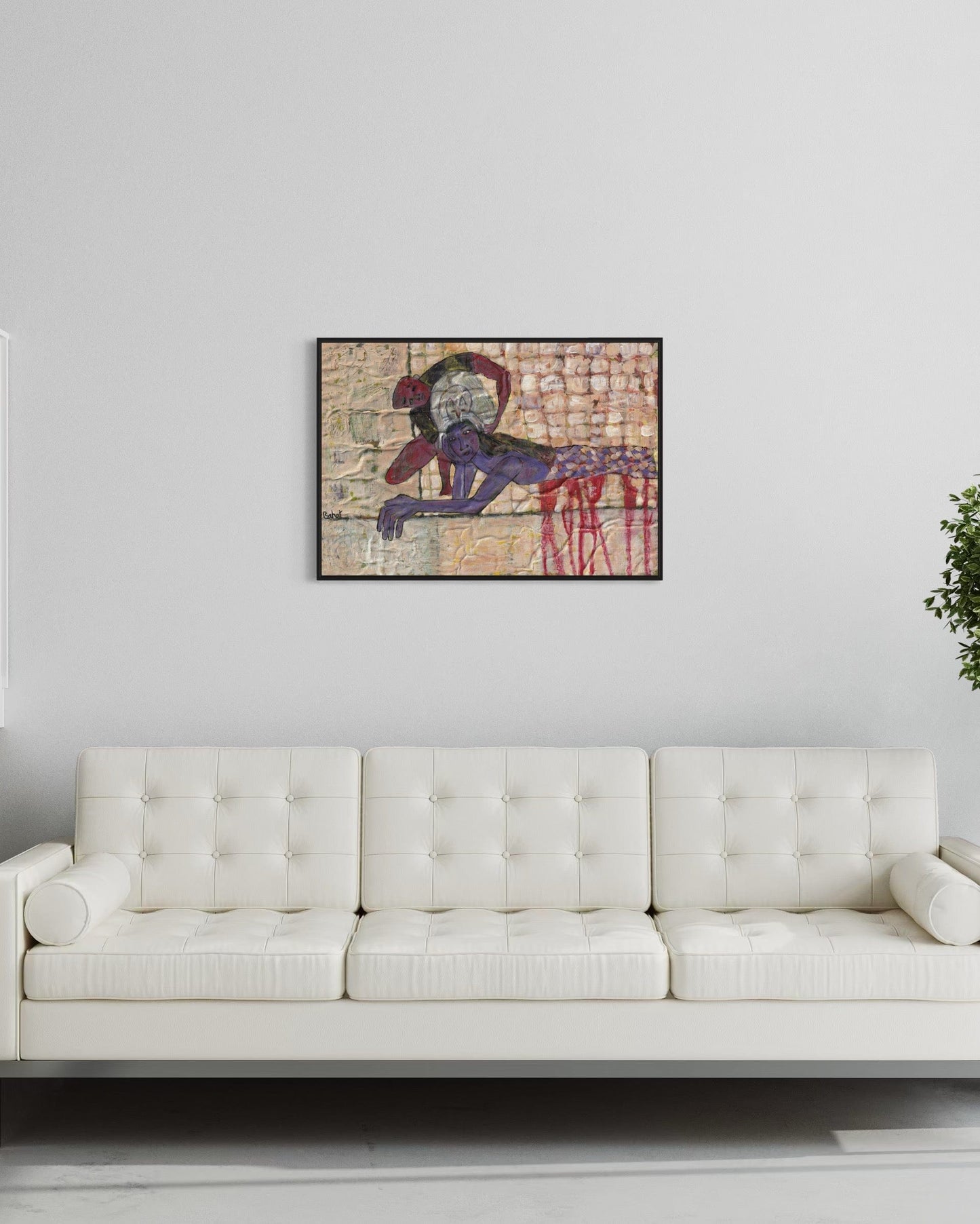 Abstract painting on a wall above a white sofa in a room with a plant.