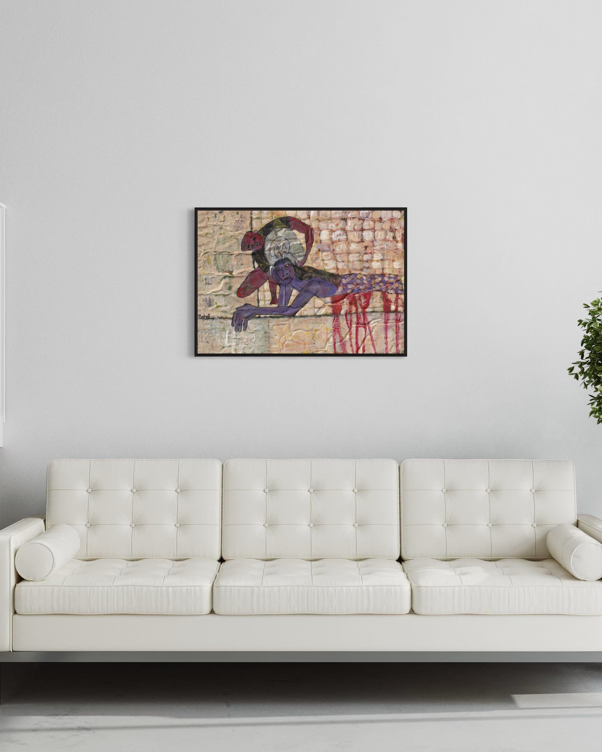 Abstract painting on a wall above a white sofa in a room with a plant.