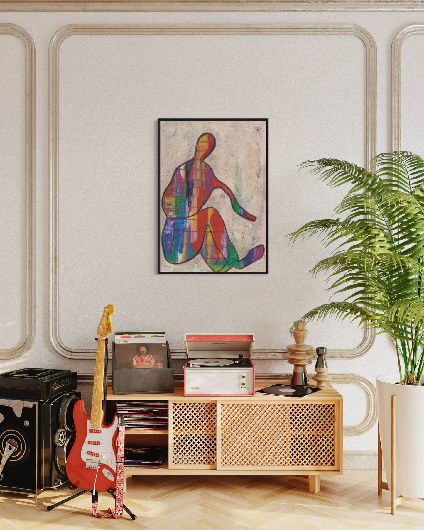 Living room with a wooden console table, guitar, and colorful abstract art on the wall.