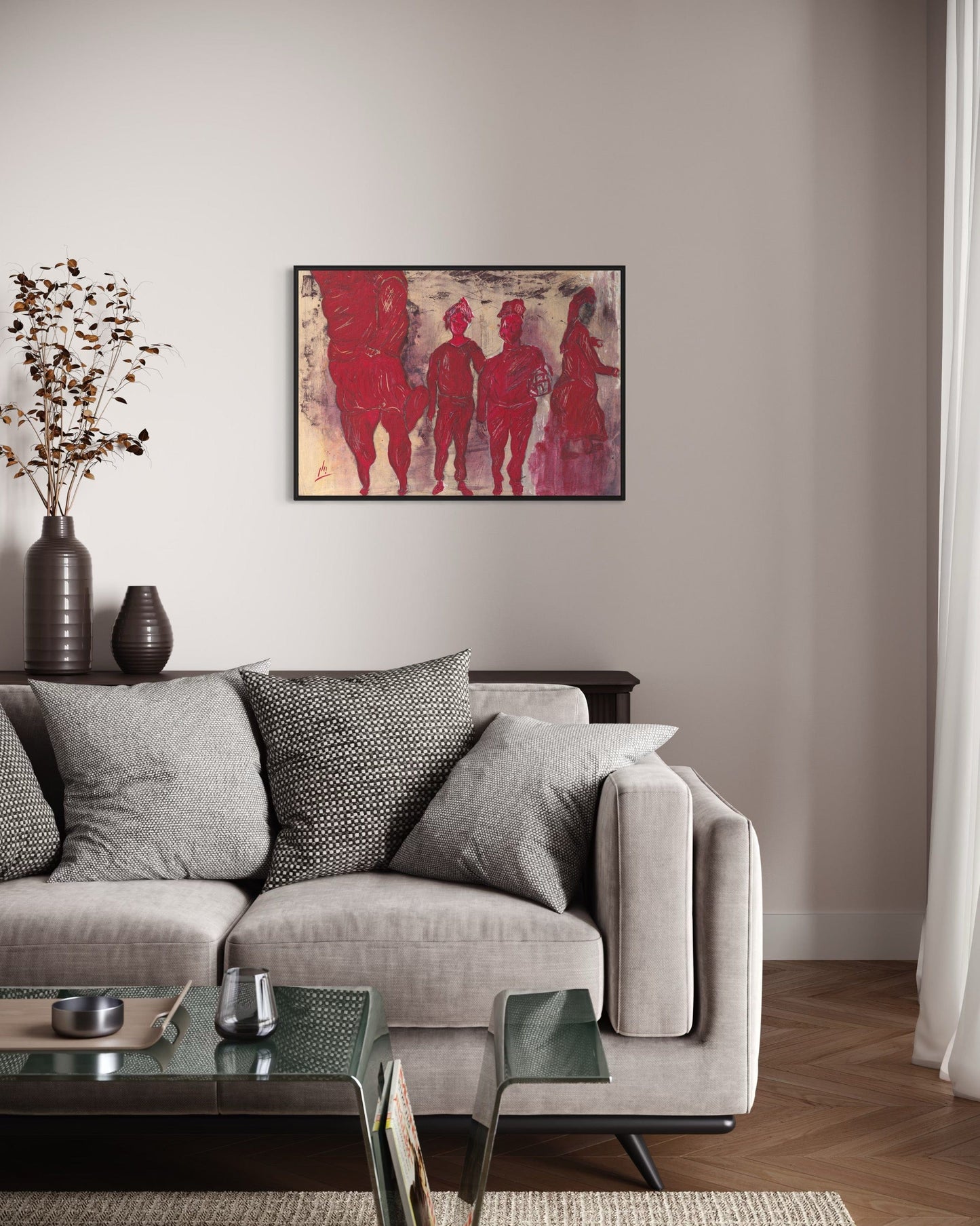 Living room with a gray sofa, coffee table, and abstract art on the wall.