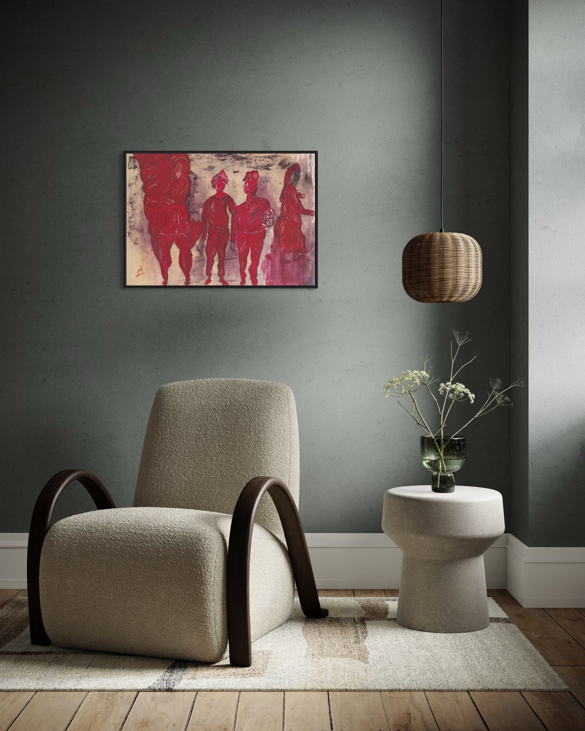 Beige armchair in a room with a gray wall, abstract red painting, and a small table with a plant.
