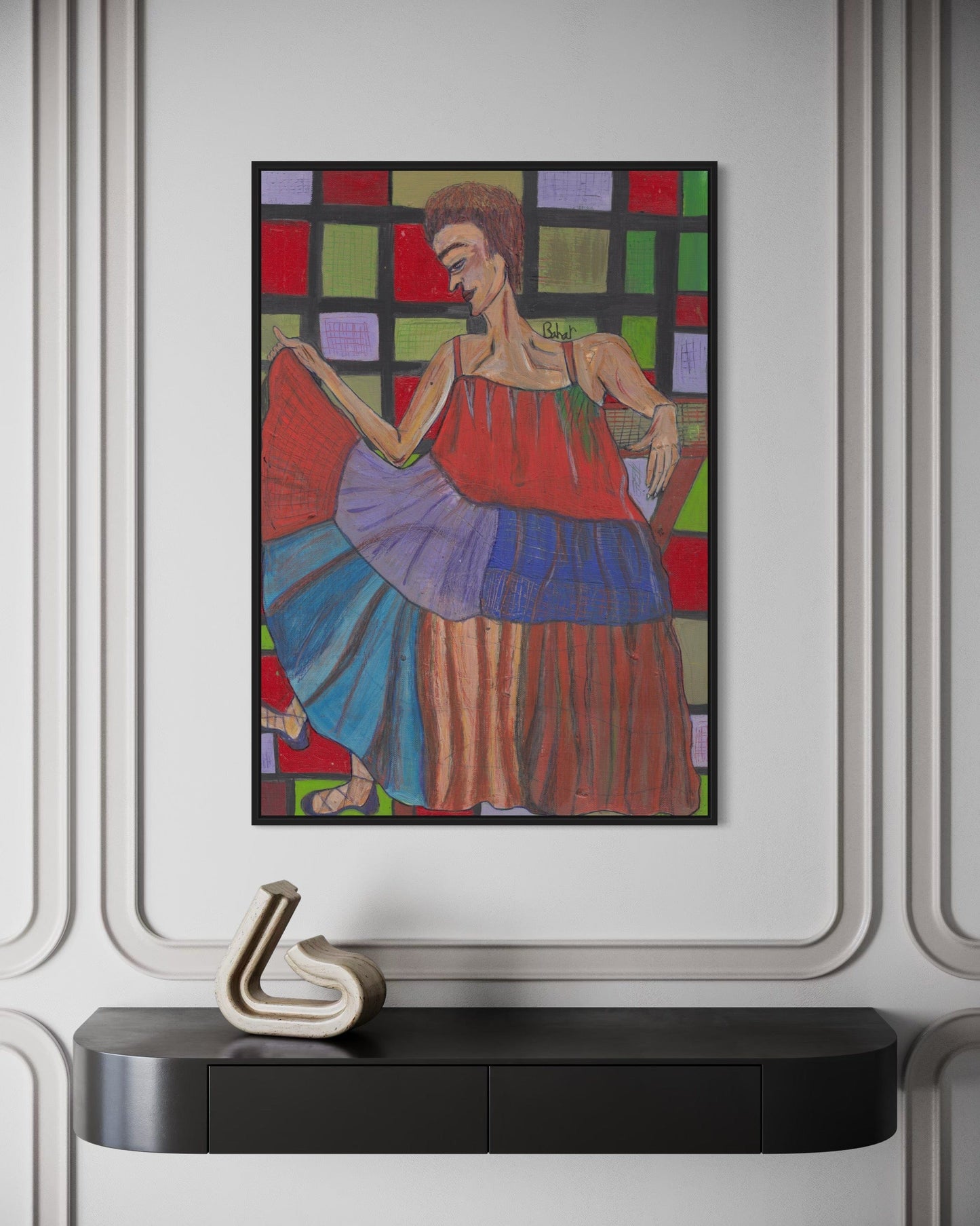 Colorful abstract painting of a woman in a red dress on a wall above a black console table.