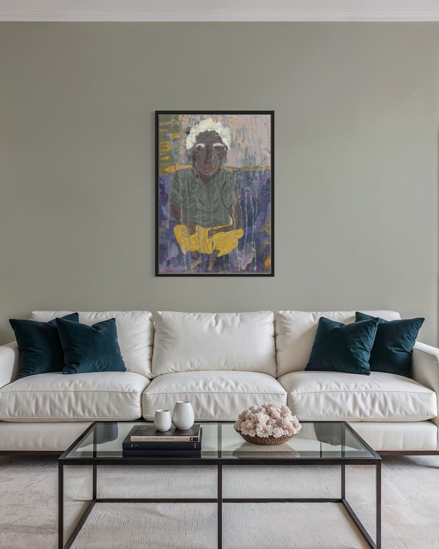 Living room with a white sofa, glass coffee table, and abstract painting on the wall.