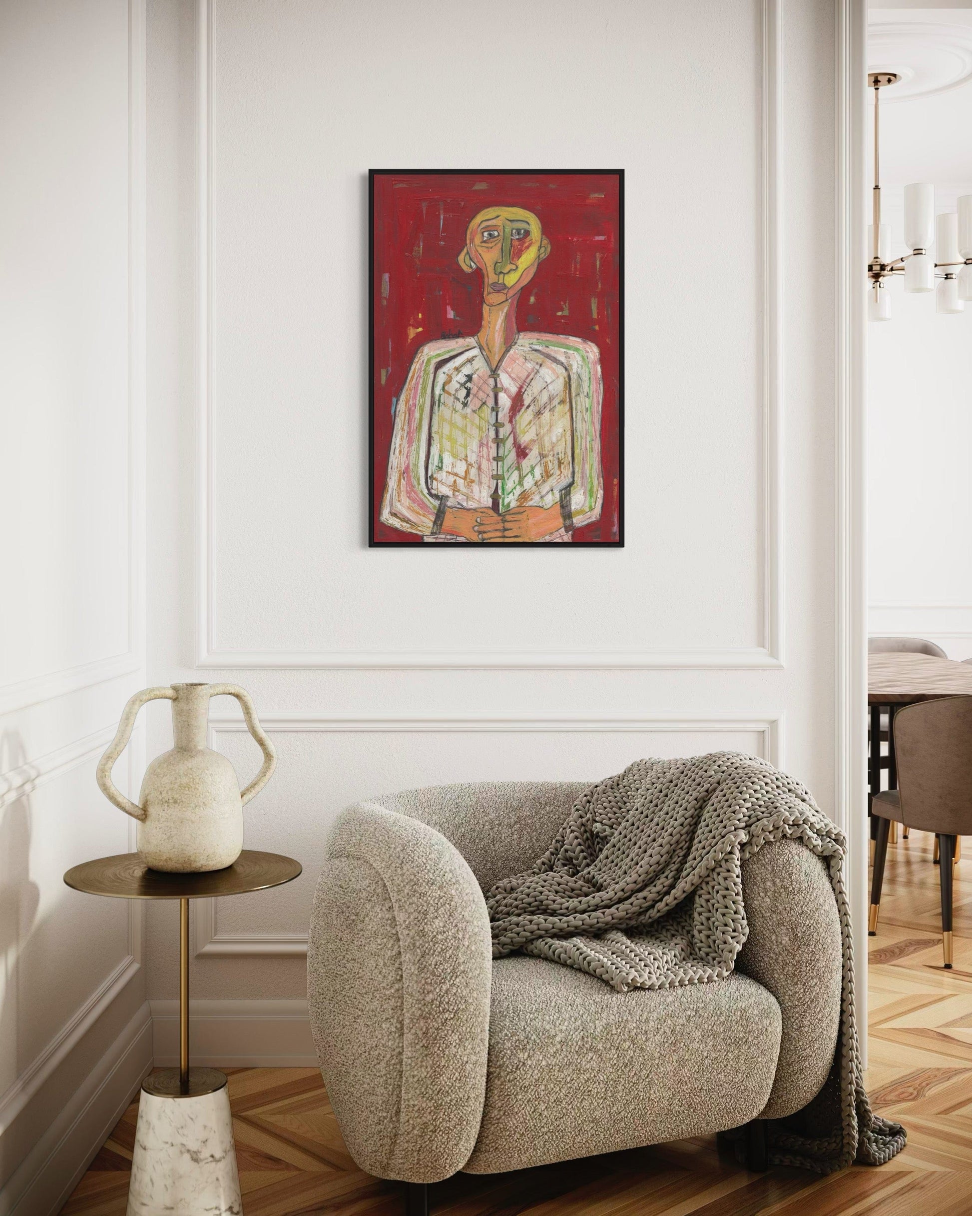 Modern interior with a textured armchair, side table, and abstract painting on the wall.