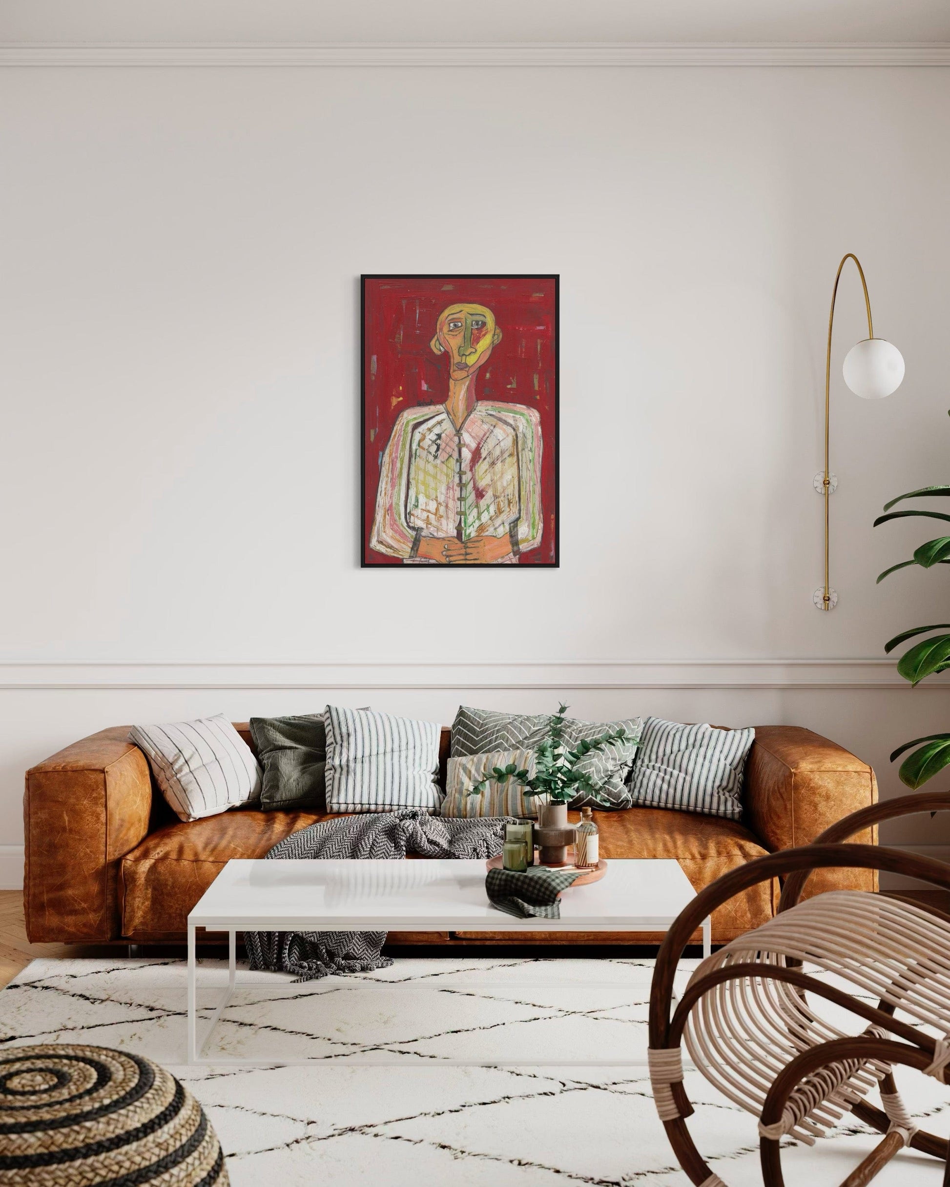 Living room with brown sofa, coffee table, and decorative items.