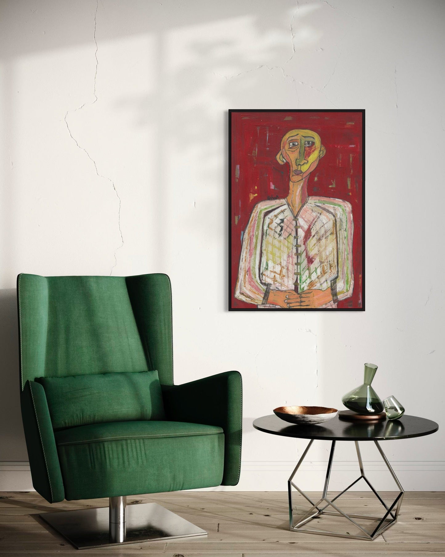 Green armchair in a room with a modern abstract painting on the wall.