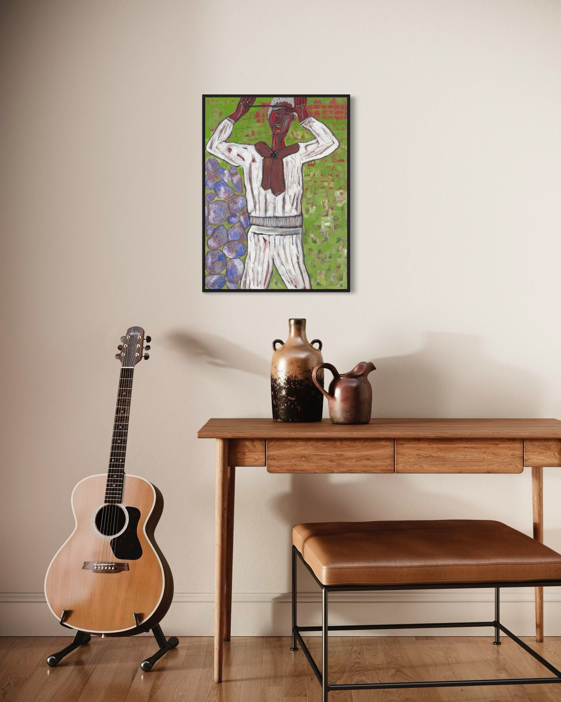 Guitar, wooden table with vases, and bench against a wall with a framed artwork.