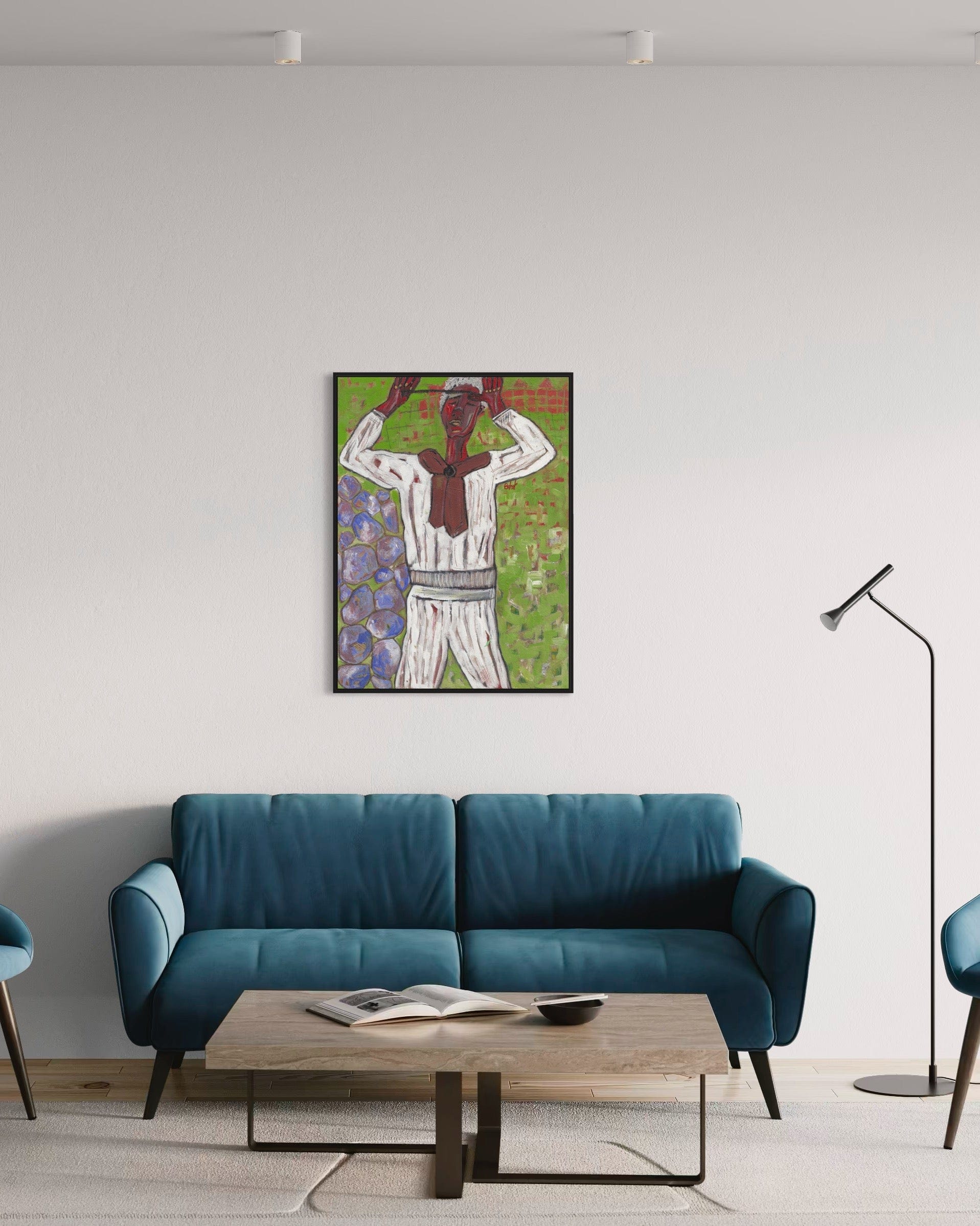 Modern living room with a blue sofa, wooden coffee table, and framed artwork on the wall.