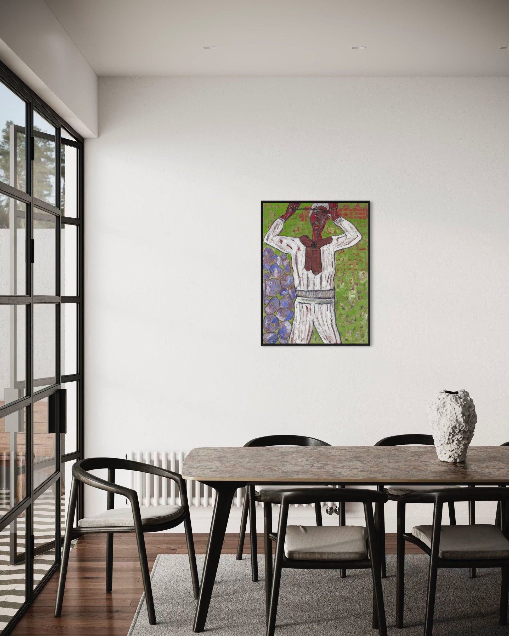 Dining room with a wooden table and chairs, featuring a colorful abstract painting on the wall.