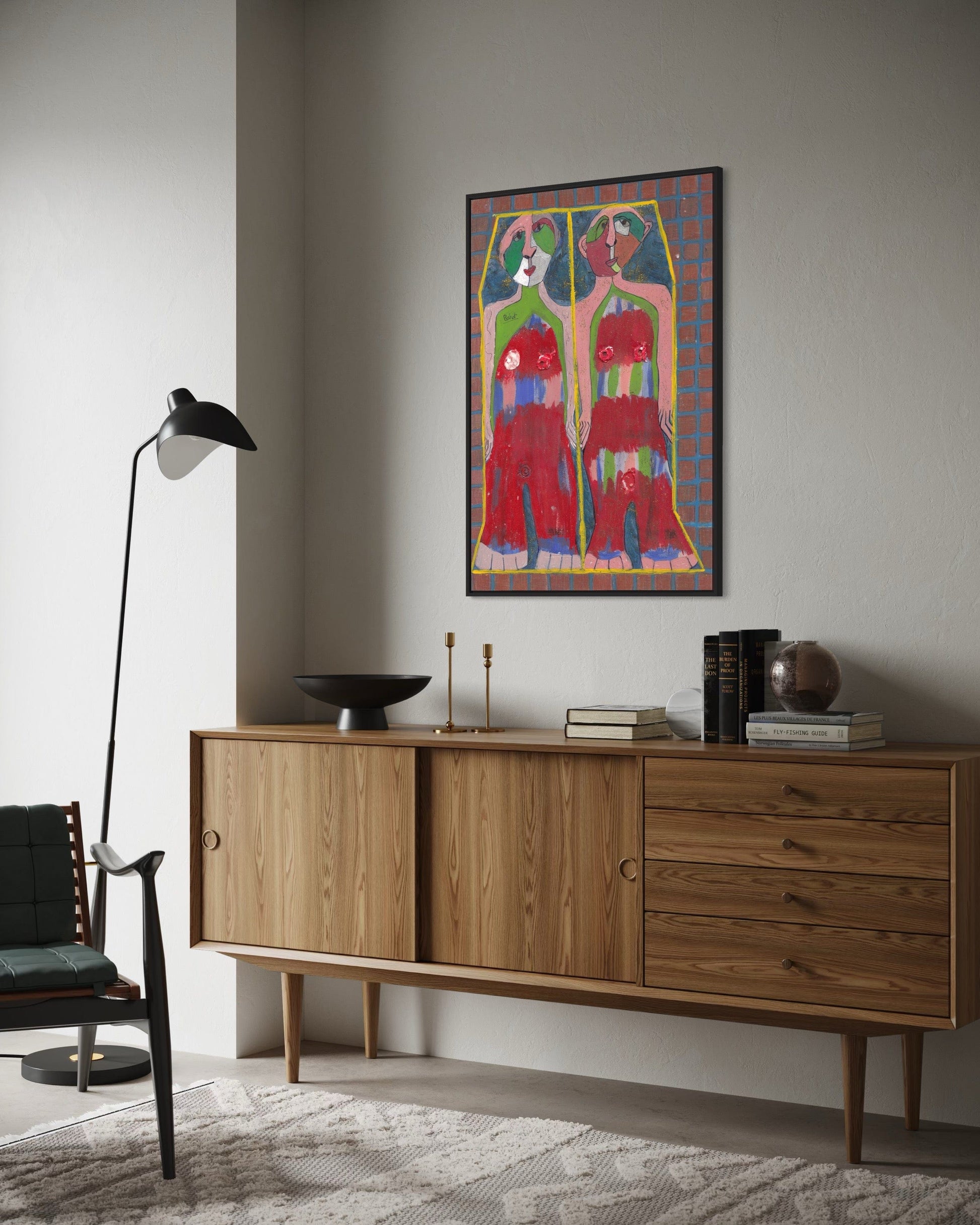 Wooden sideboard with decorative items in a room with a colorful abstract painting on the wall.