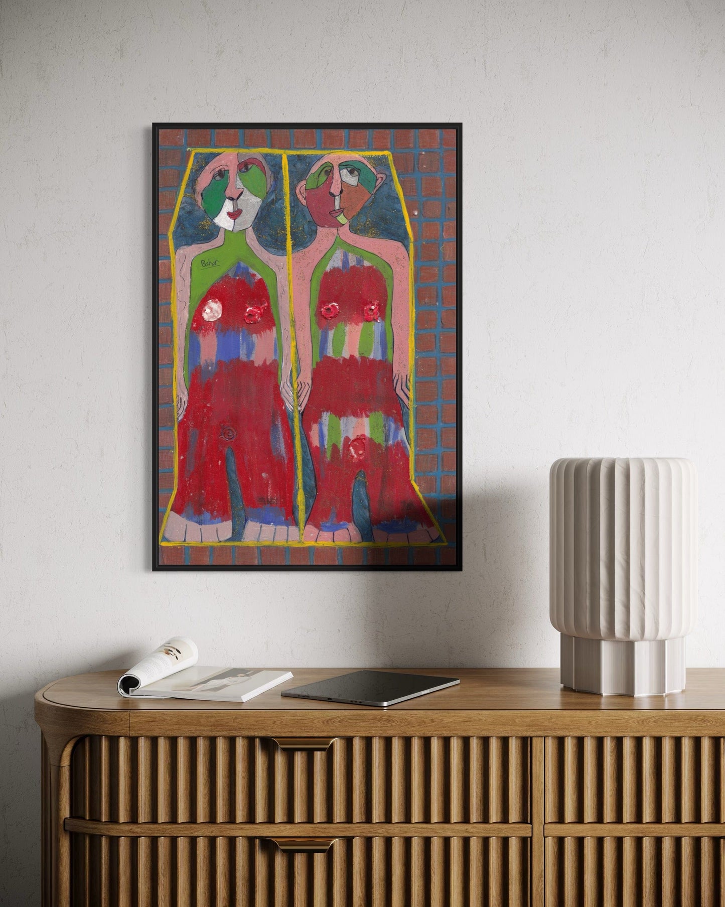 Colorful abstract painting on a wall above a wooden console table.