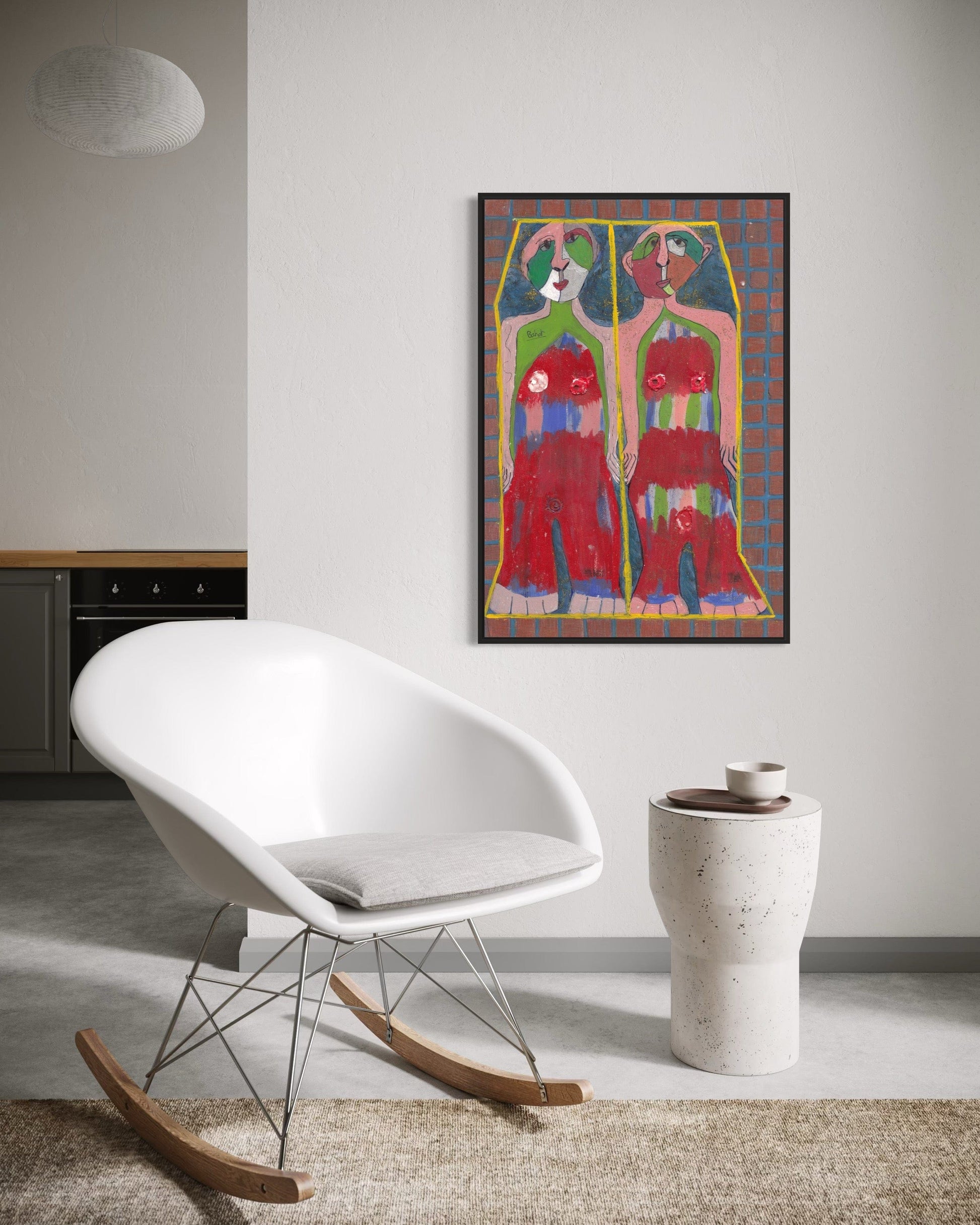Modern interior with a white rocking chair, a vase, and a colorful abstract painting on the wall.