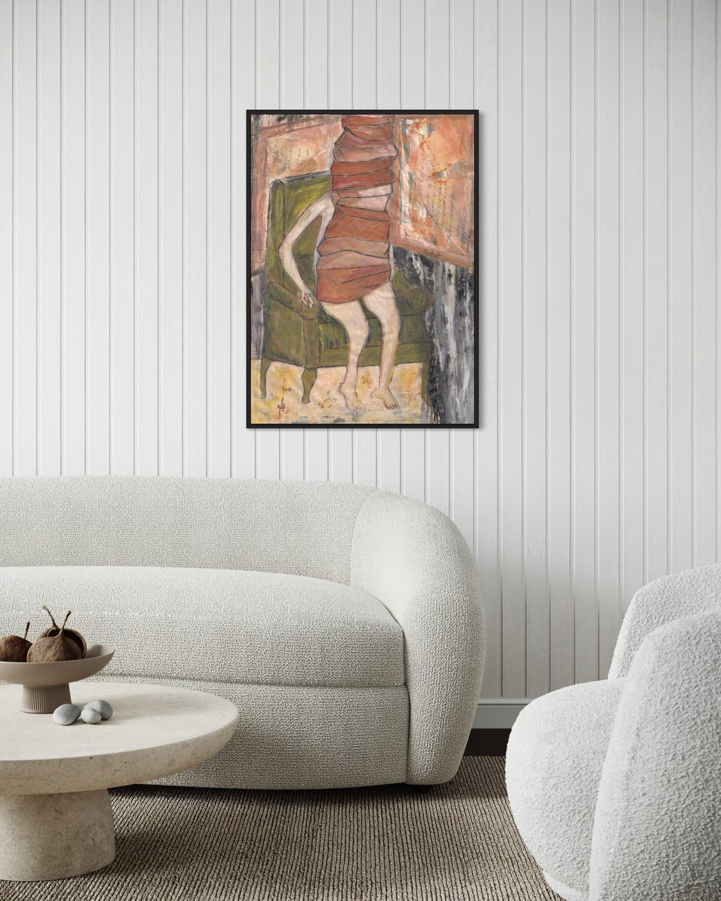Abstract painting on a wall above a modern sofa in a living room.