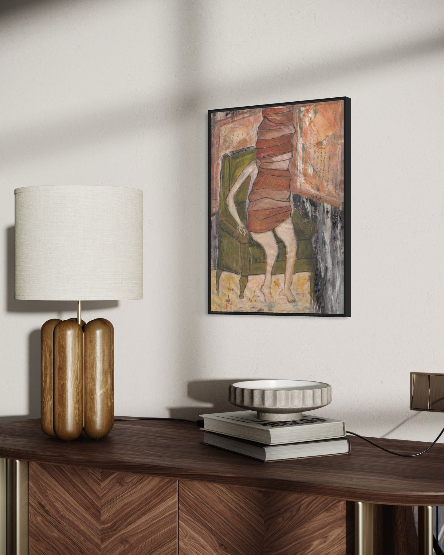 Decorative lamp, books, and abstract painting on a wooden surface.