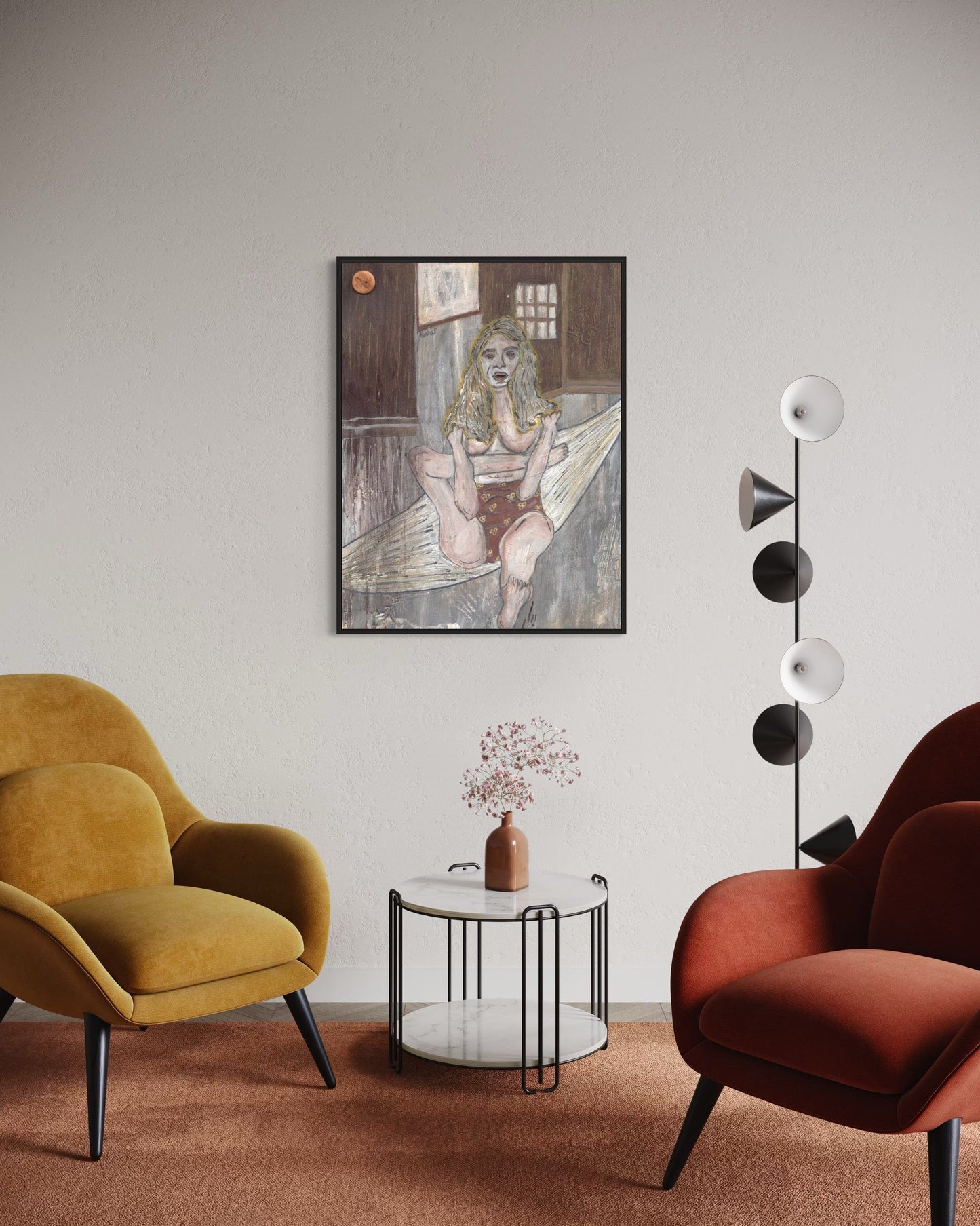 Modern living room with two armchairs, a side table, and a wall art piece.