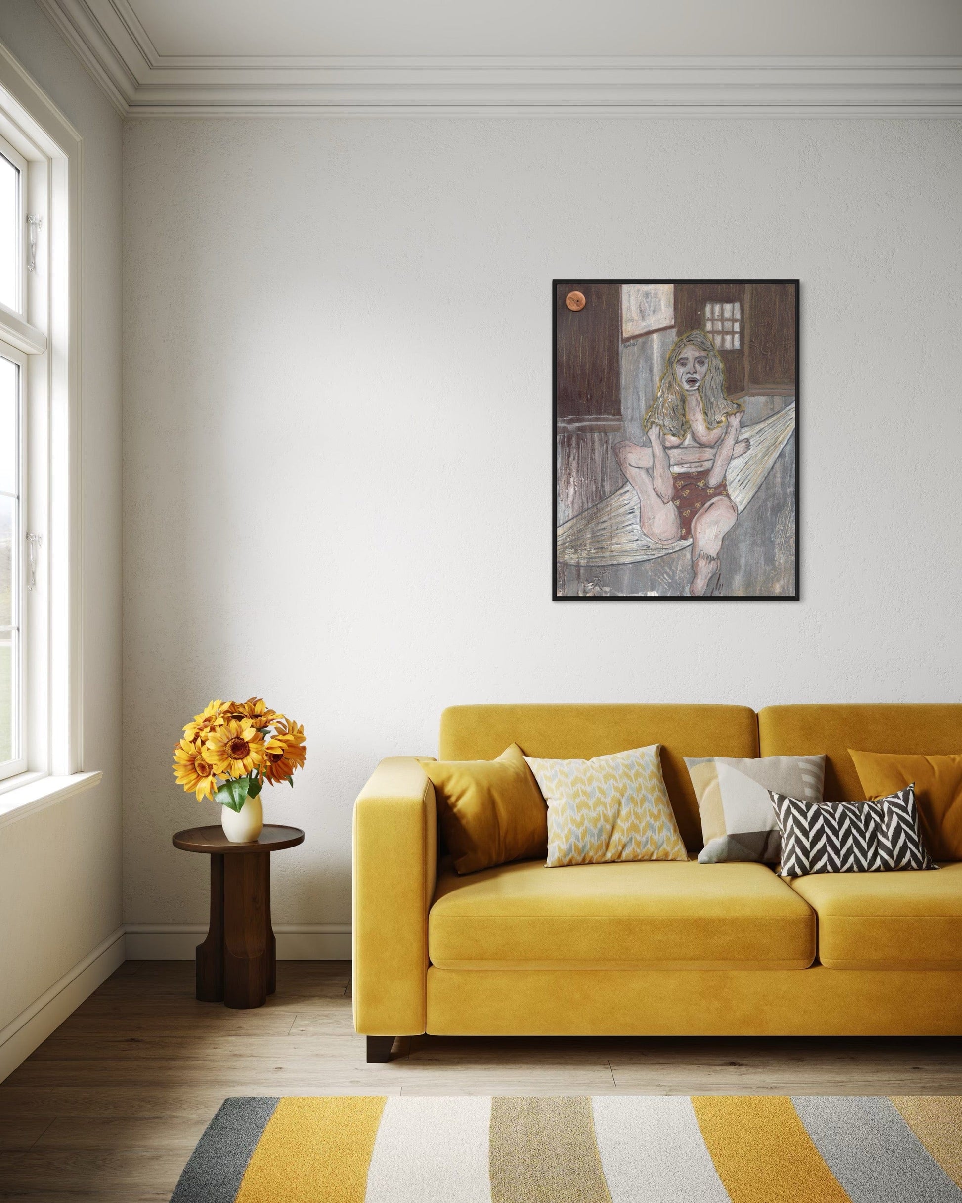 Living room with yellow sofa, side table with flowers, and wall art.