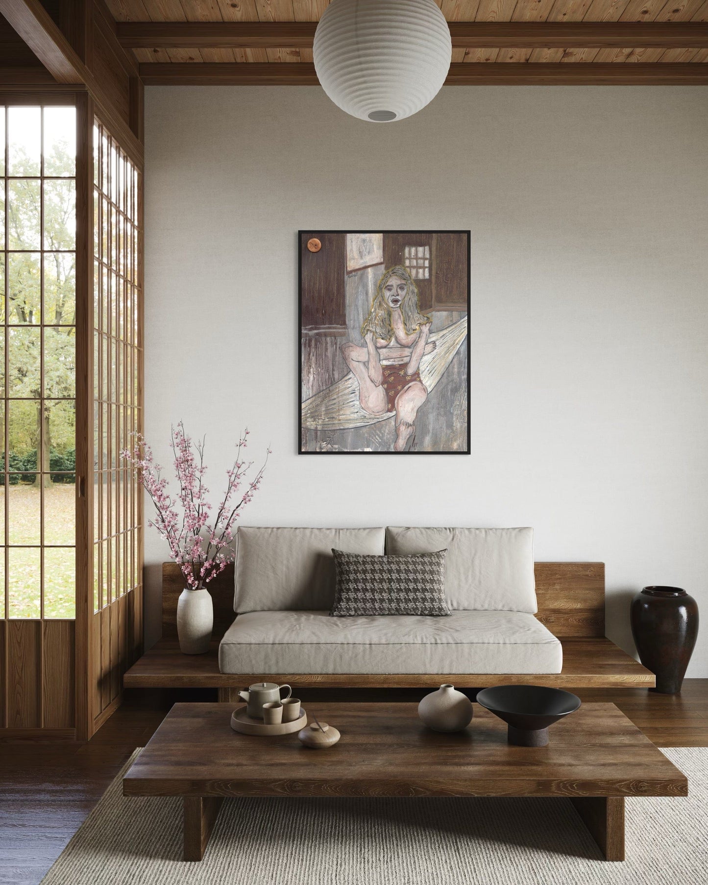 Modern living room with a sofa, coffee table, and wall art.