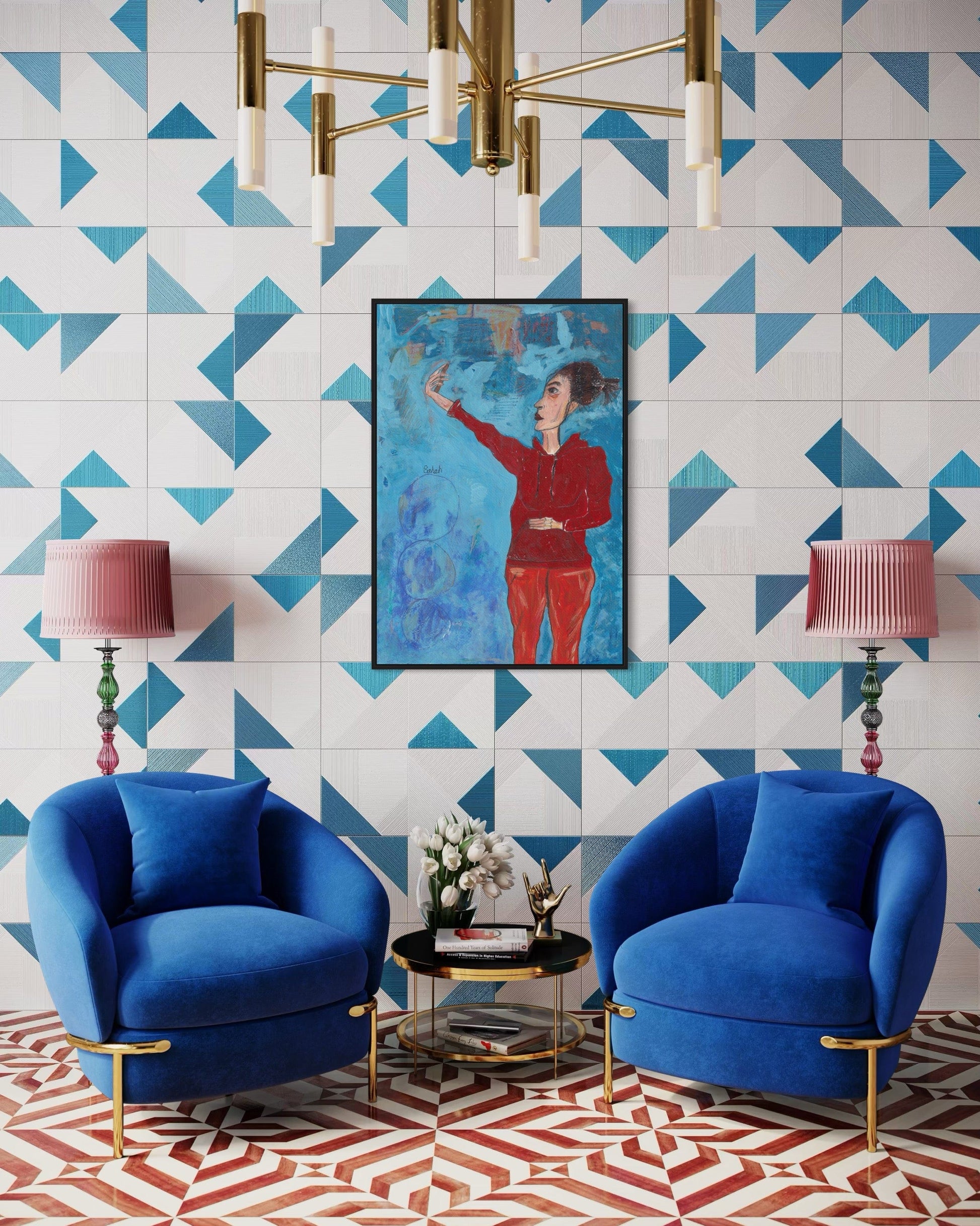 Modern living room with blue armchairs, geometric wall tiles, and a chandelier.