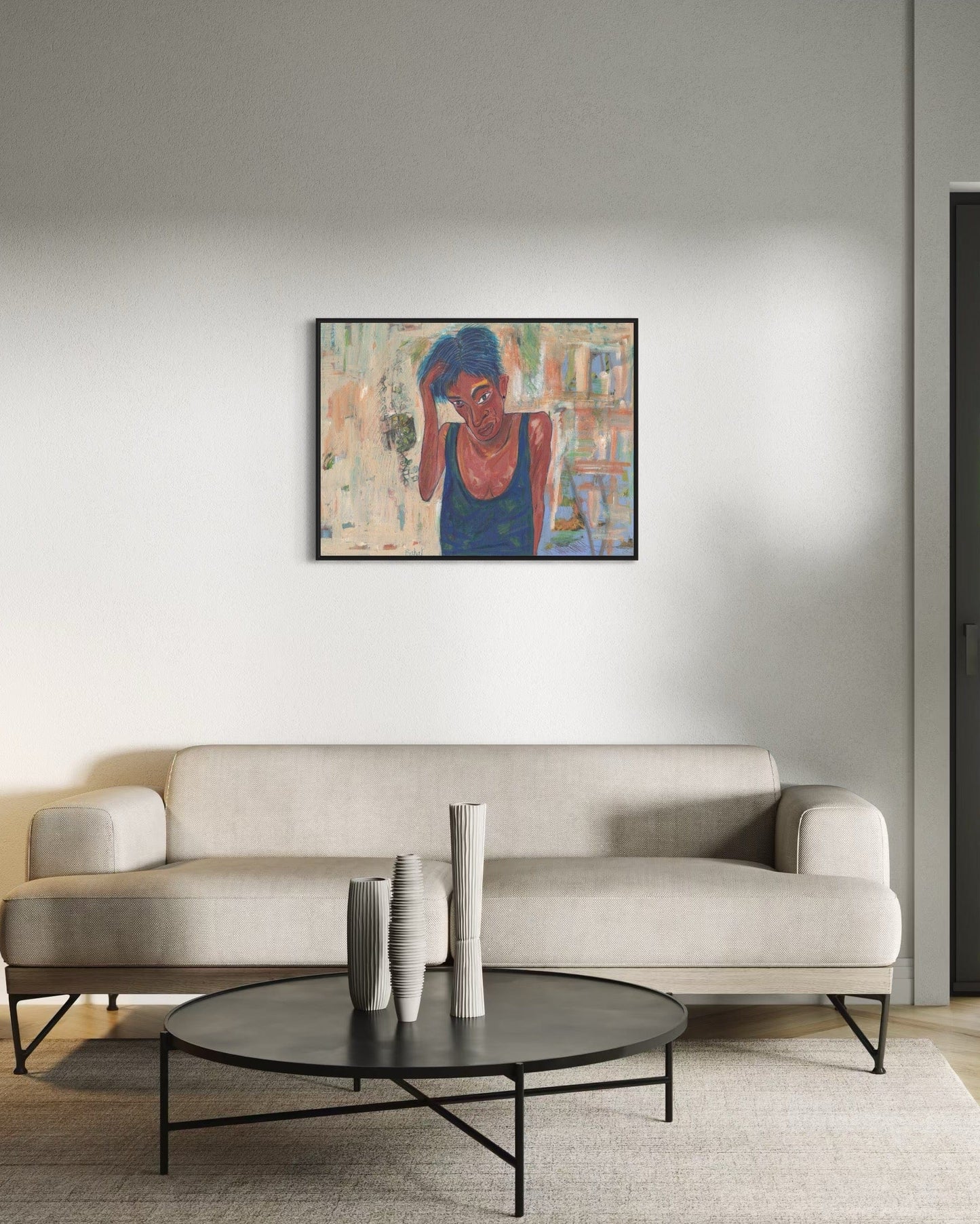 Modern living room with a beige sofa, round coffee table, and abstract painting on the wall.
