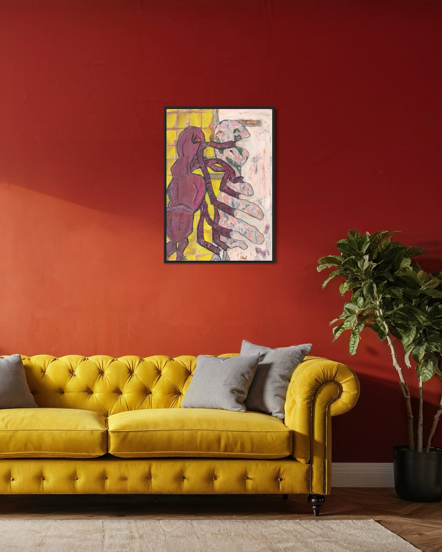 Yellow sofa with gray cushions in a room with a red wall and abstract art.