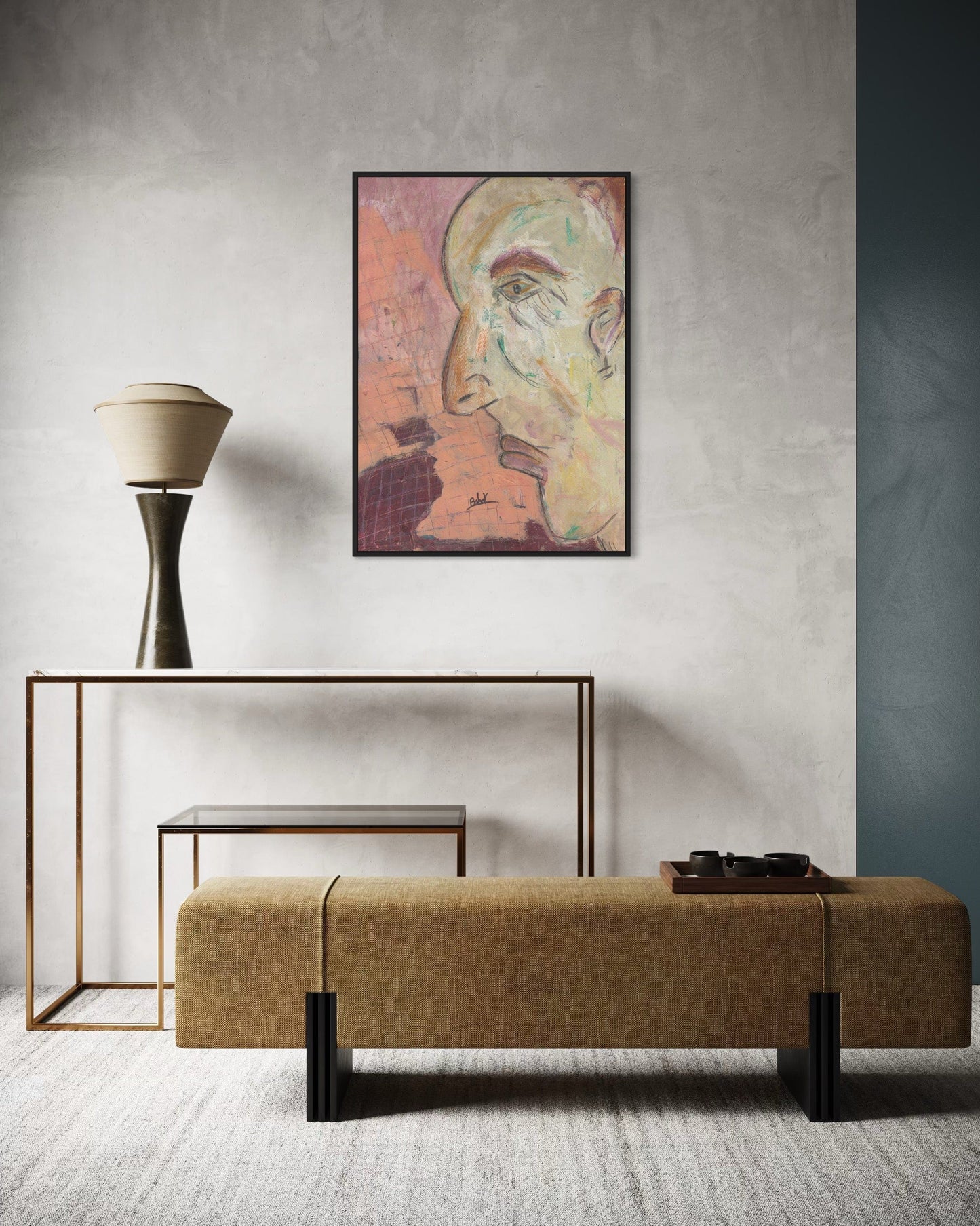 Modern interior with a bench, lamp, and framed artwork on a gray wall.