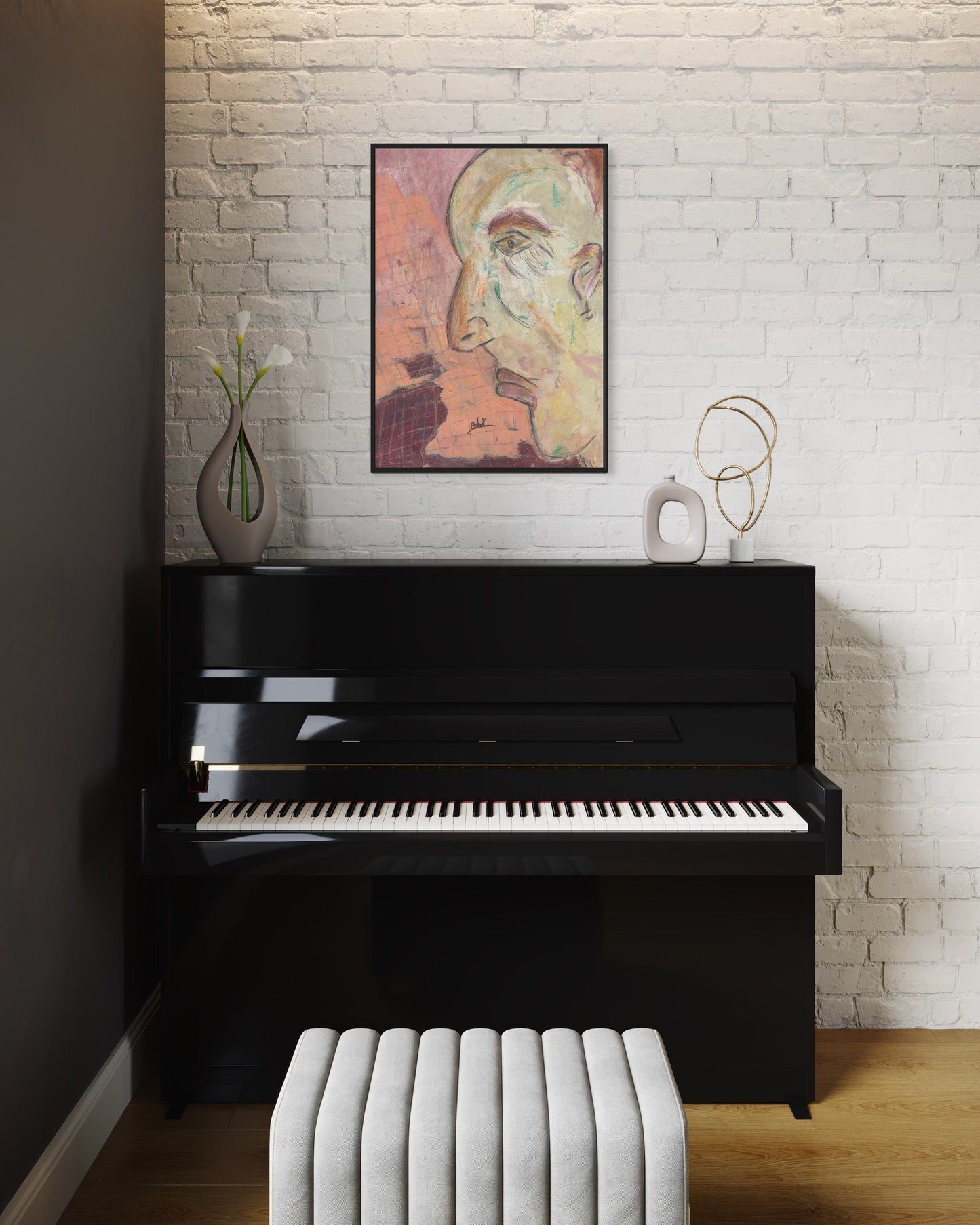 Black upright piano in a room with a white brick wall, a painting, and a vase.