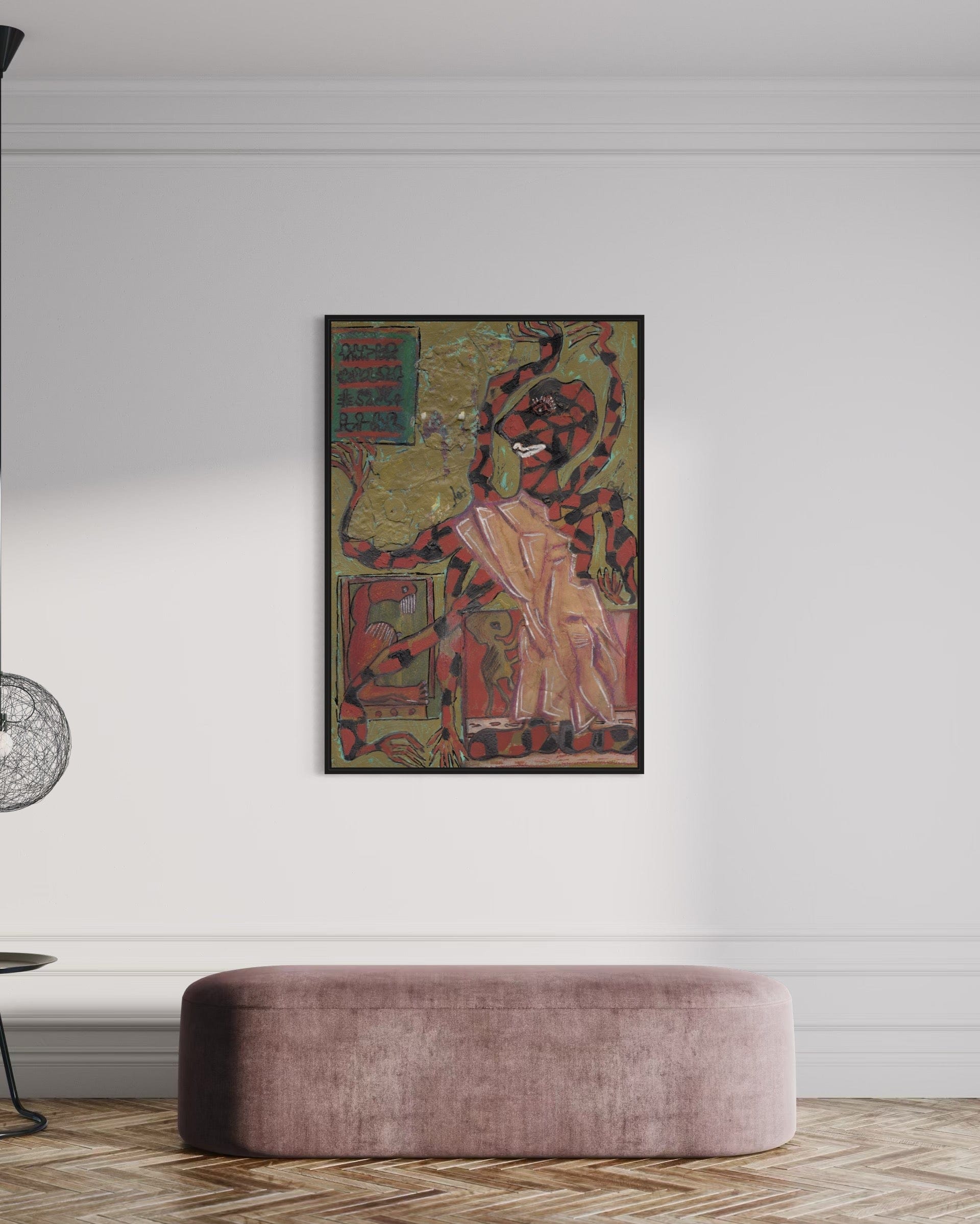Framed artwork on a wall above a modern pink ottoman in a room.