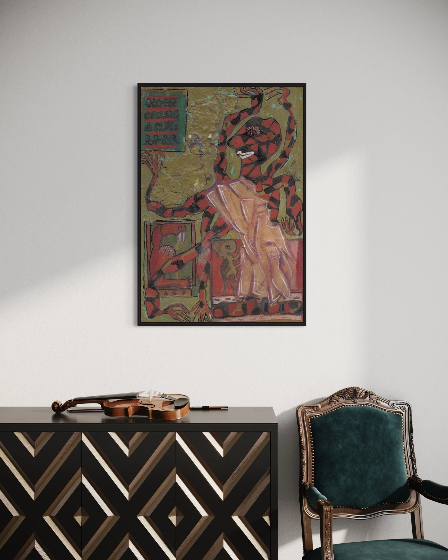 Decorative wall art above a black and gold patterned cabinet with a green chair.