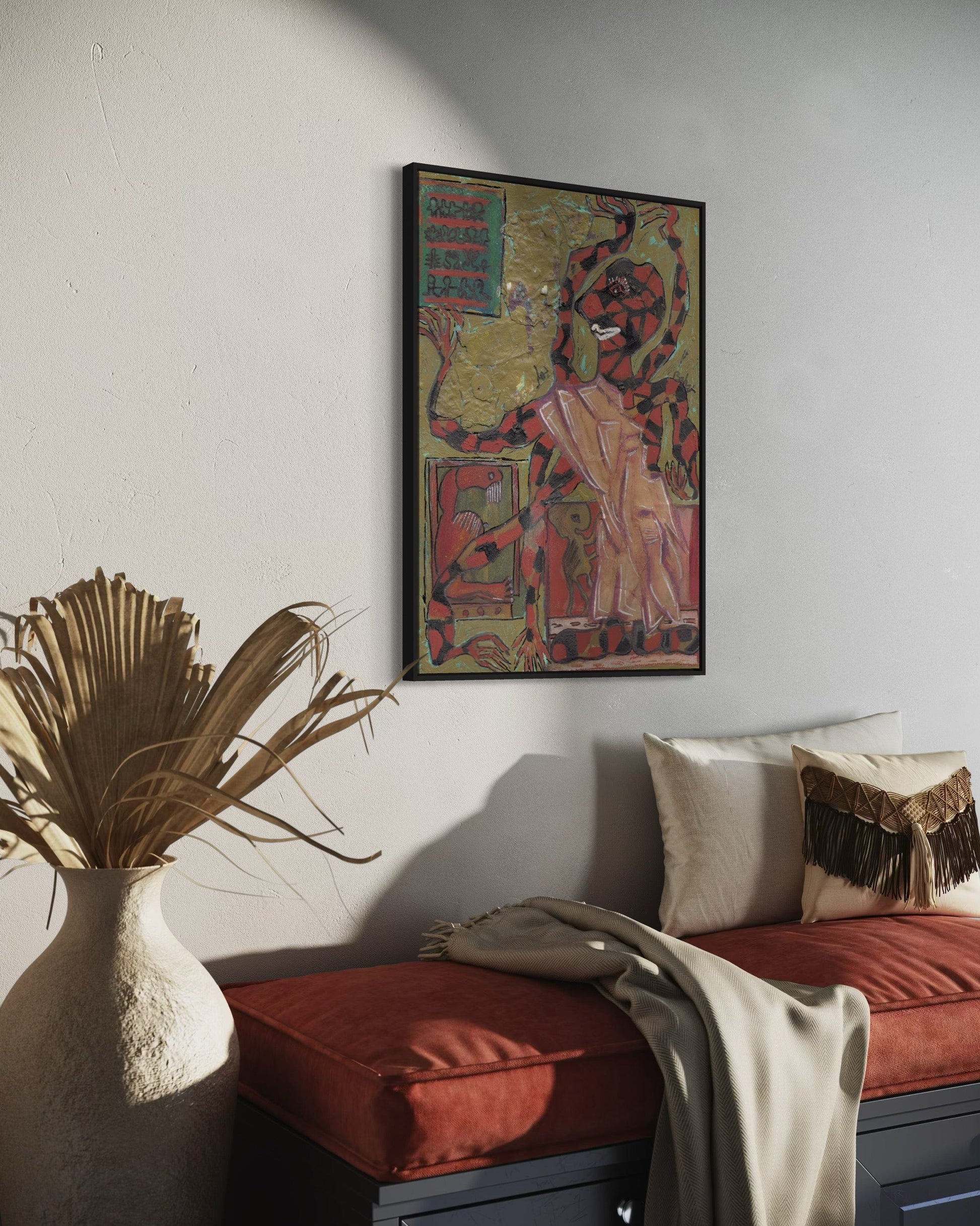Decorative interior with a colorful framed artwork on the wall, a red cushioned bench, and a vase with dried plants.