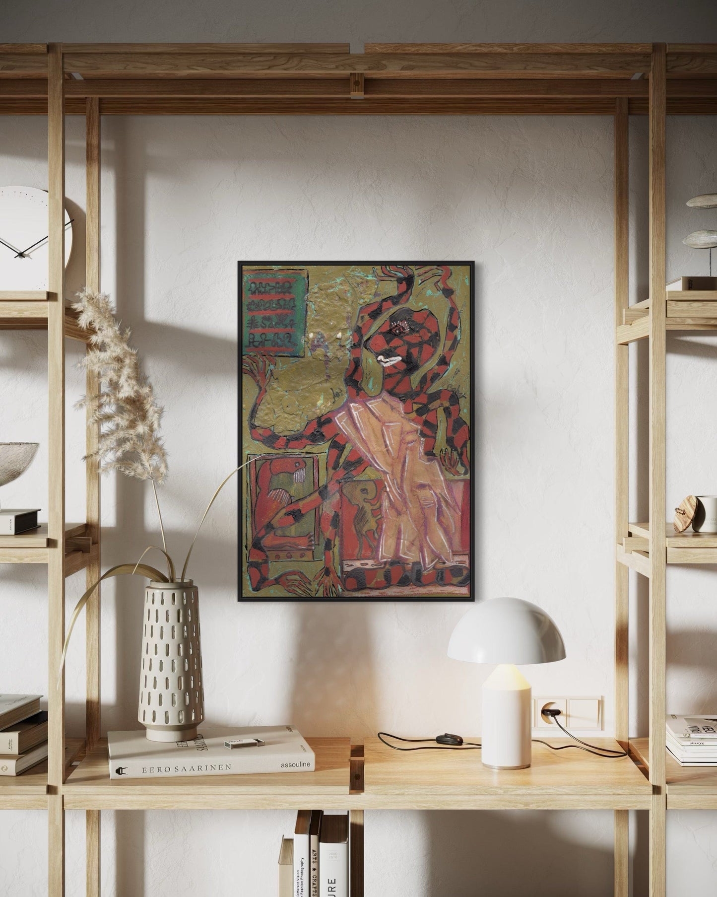 Framed artwork on a wall between wooden shelves with decor items.