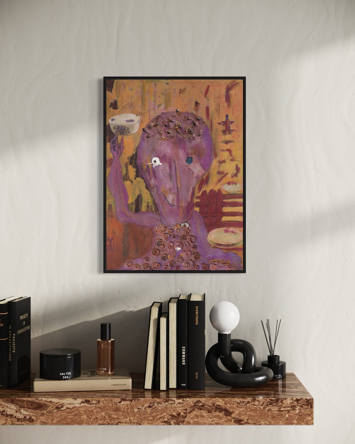 Colorful abstract painting on a wall above a shelf with books and decorative items.
