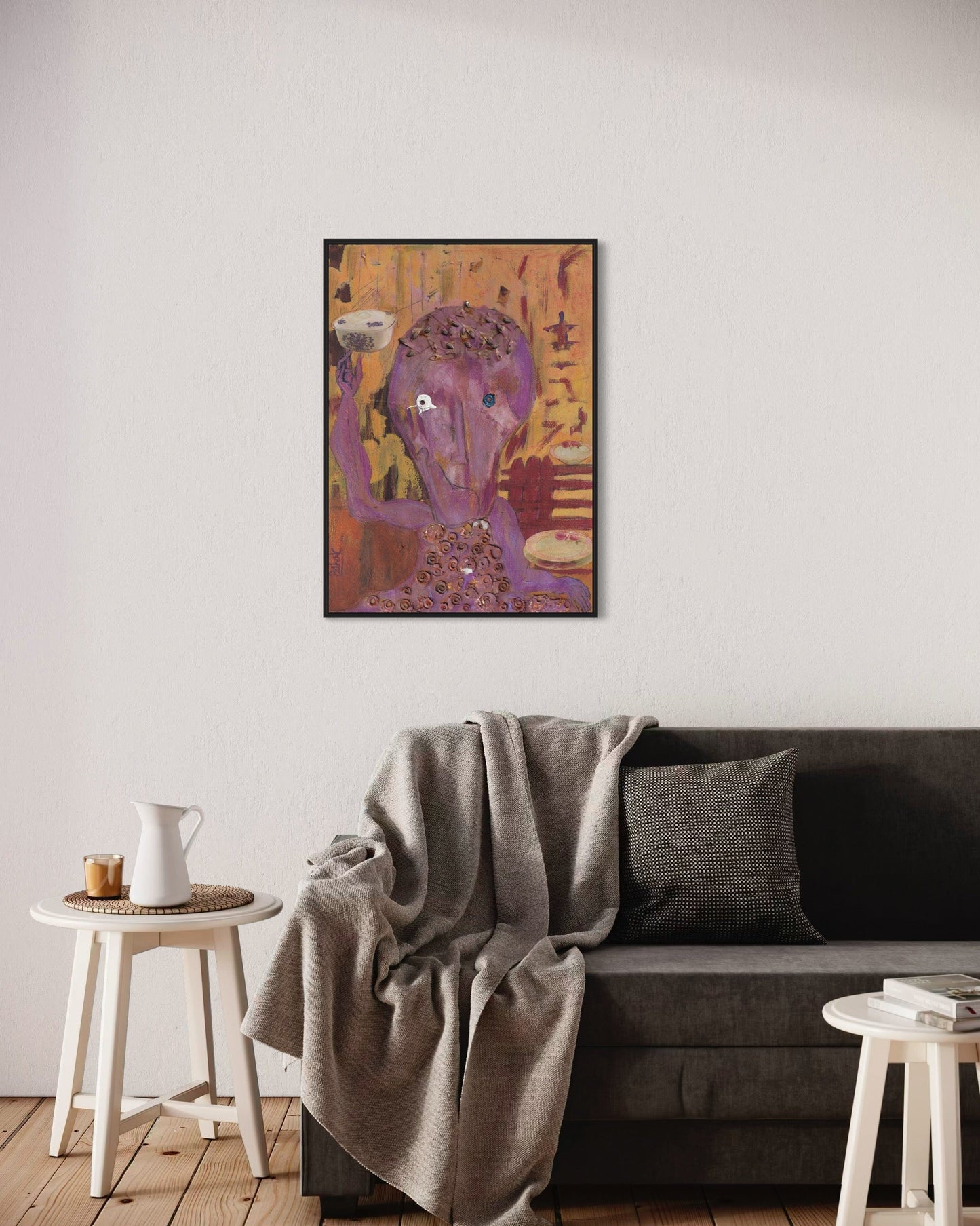 Living room with a gray sofa, small table, and colorful abstract painting on the wall.