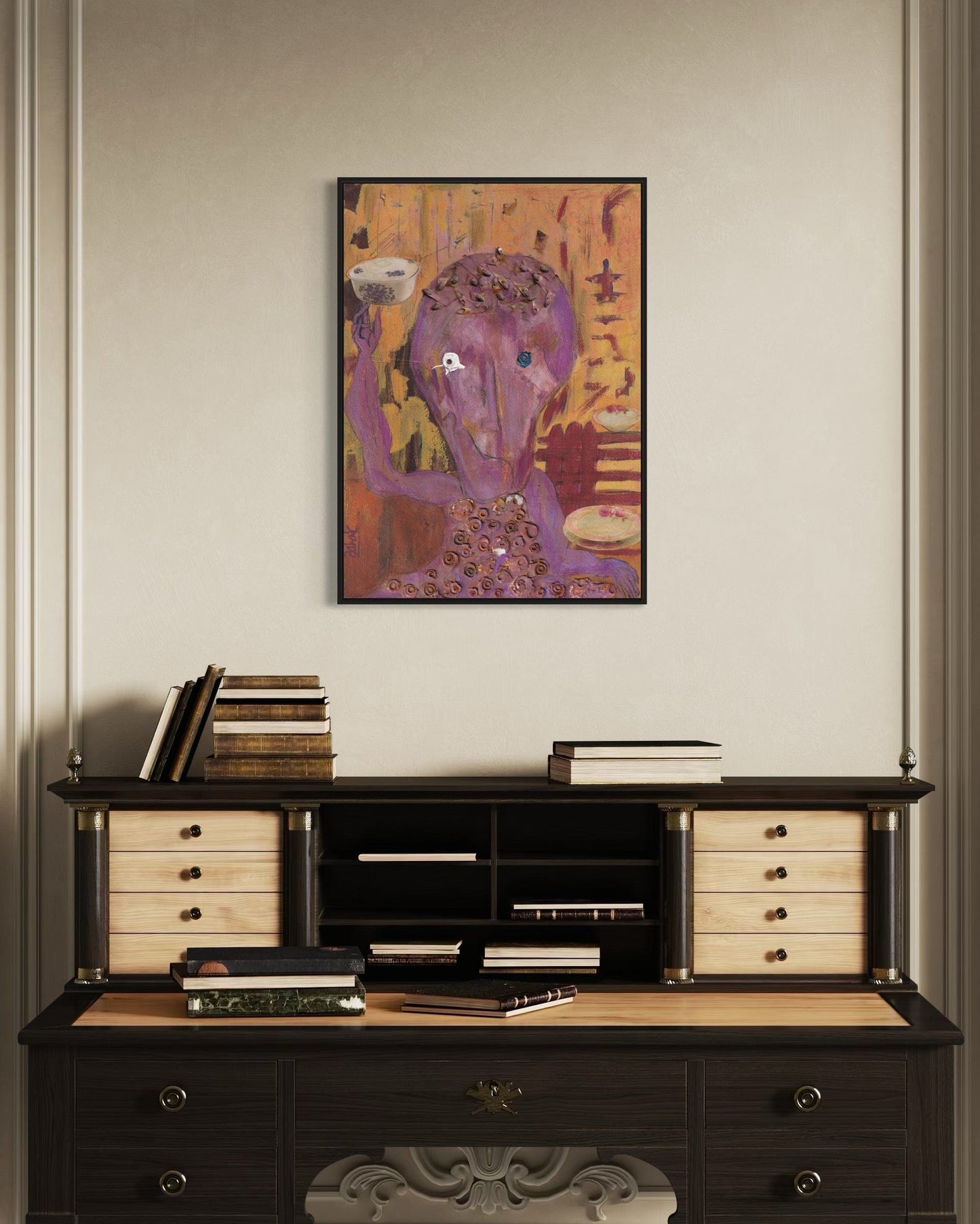 Dark wooden desk with books and a decorative item, above which is a colorful abstract painting on a beige wall.