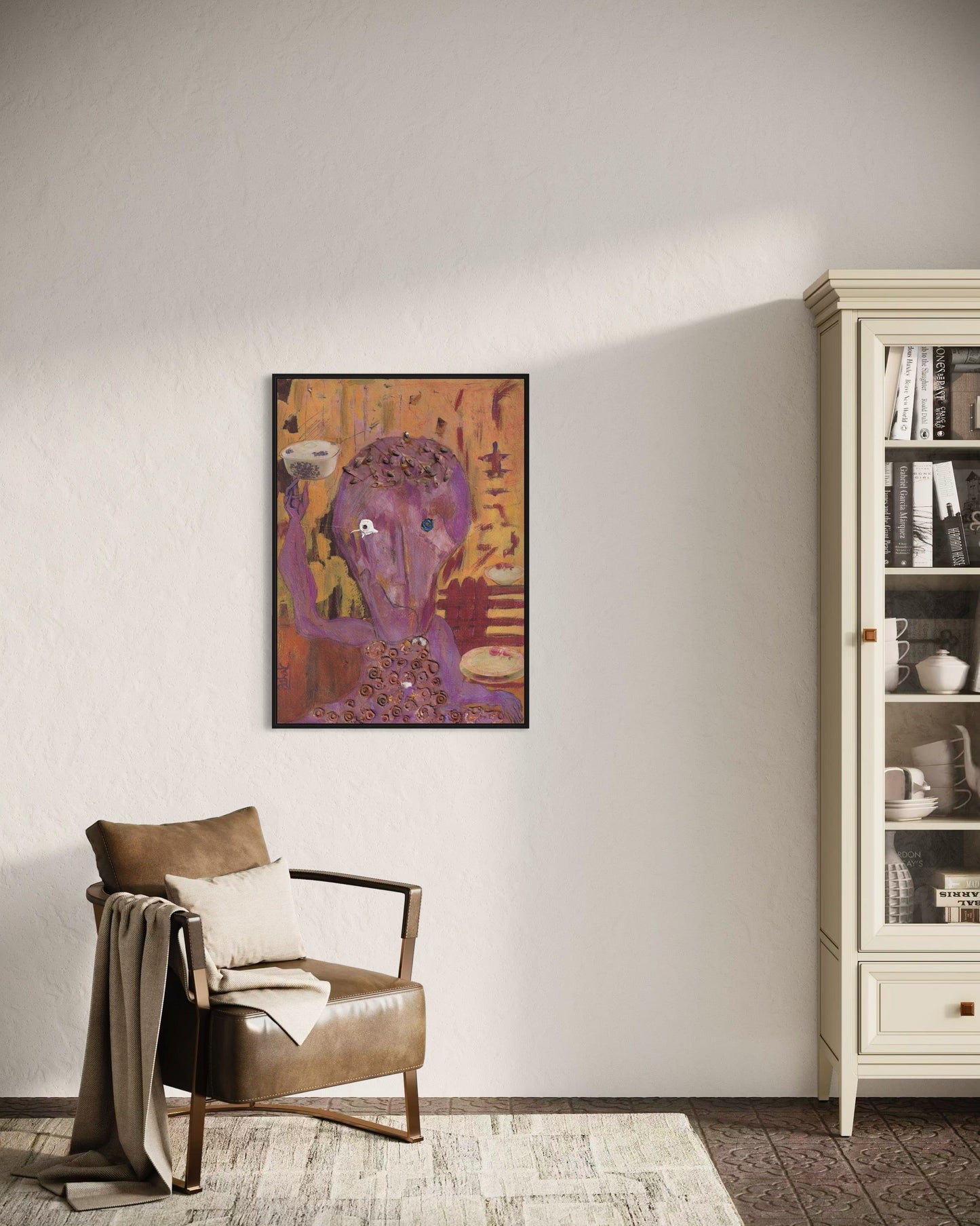 Living room with a brown armchair, colorful abstract painting, and white bookshelf.