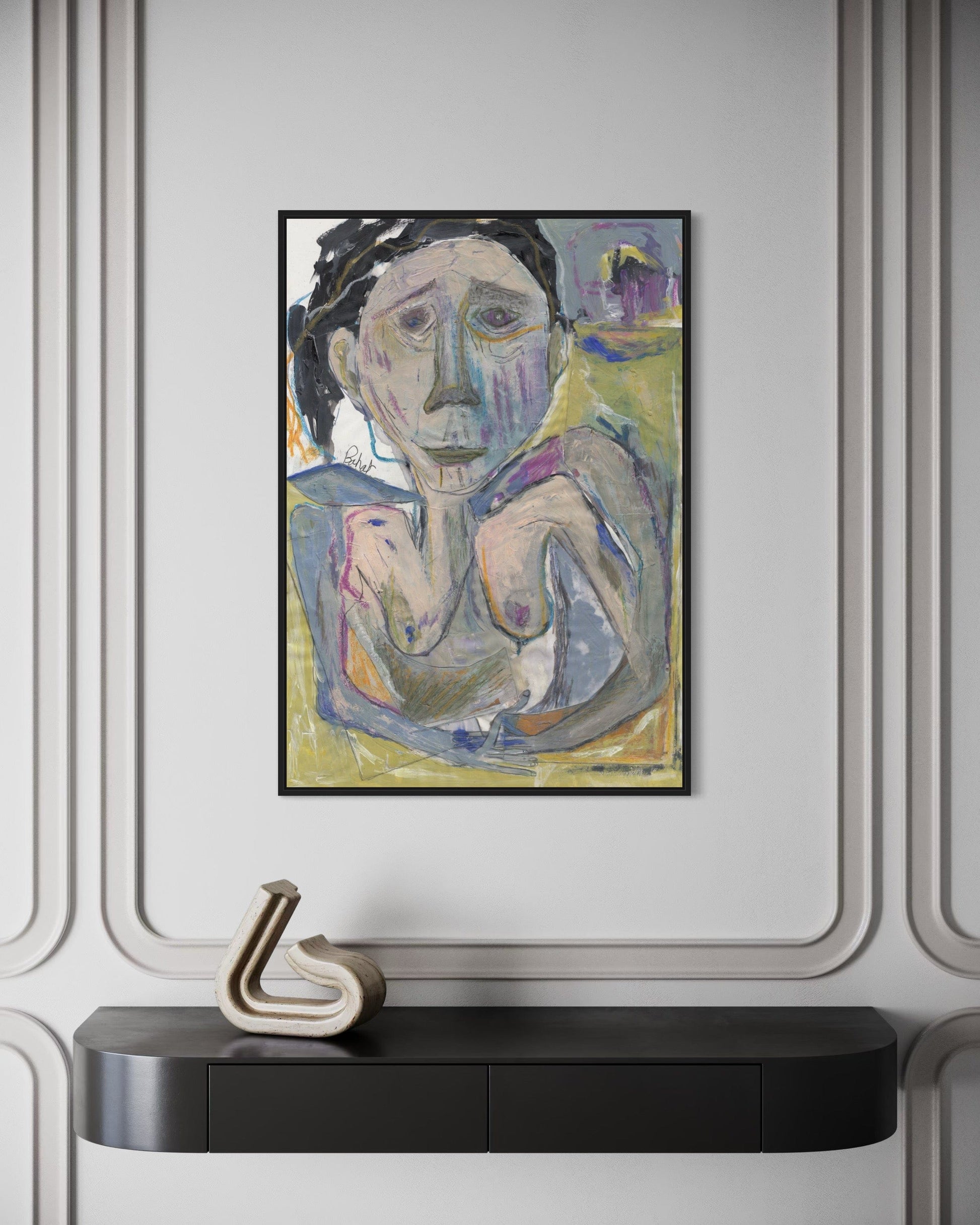 Framed abstract painting of a nude figure on a wall above a black console table.