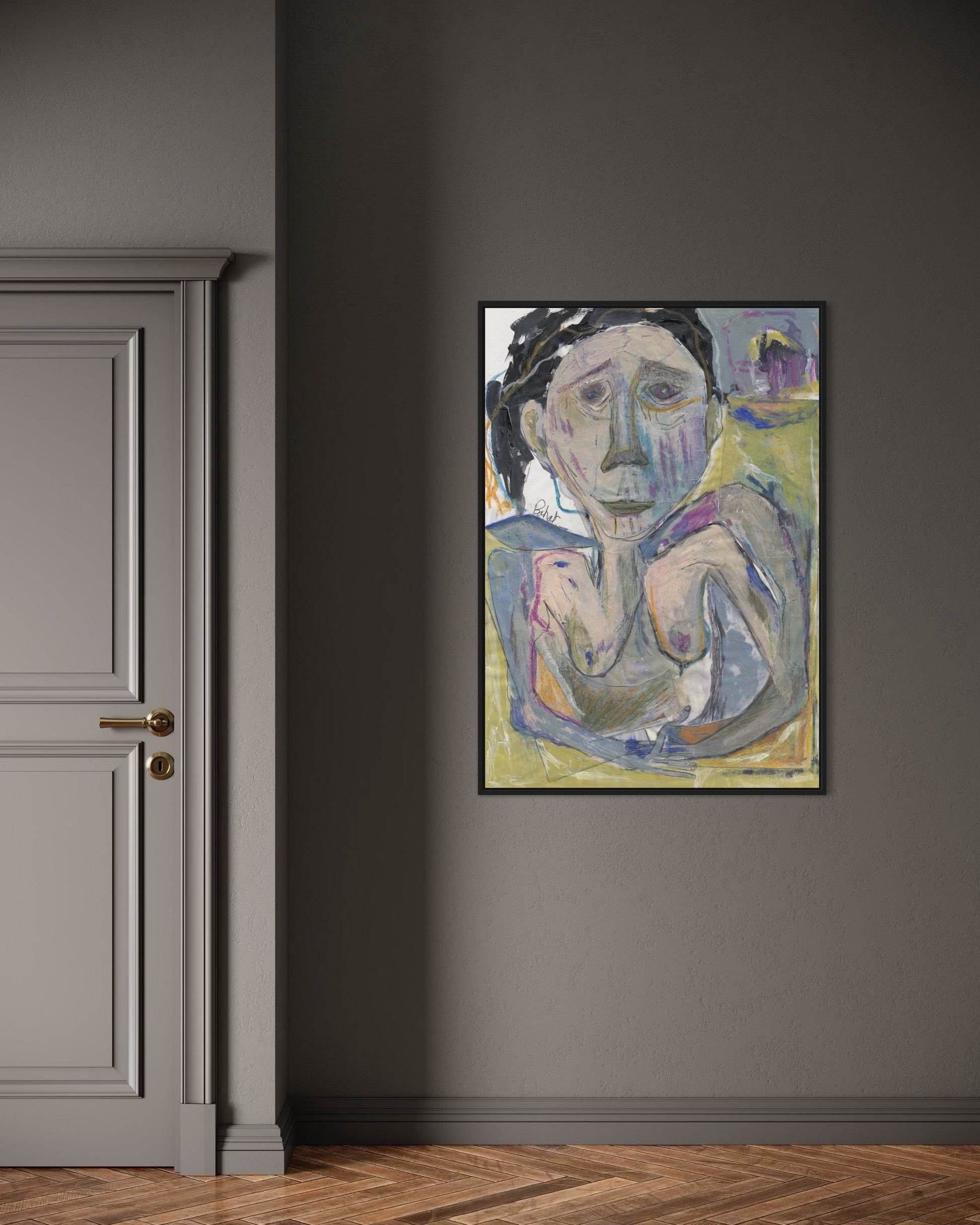Framed abstract painting on a gray wall next to a door.