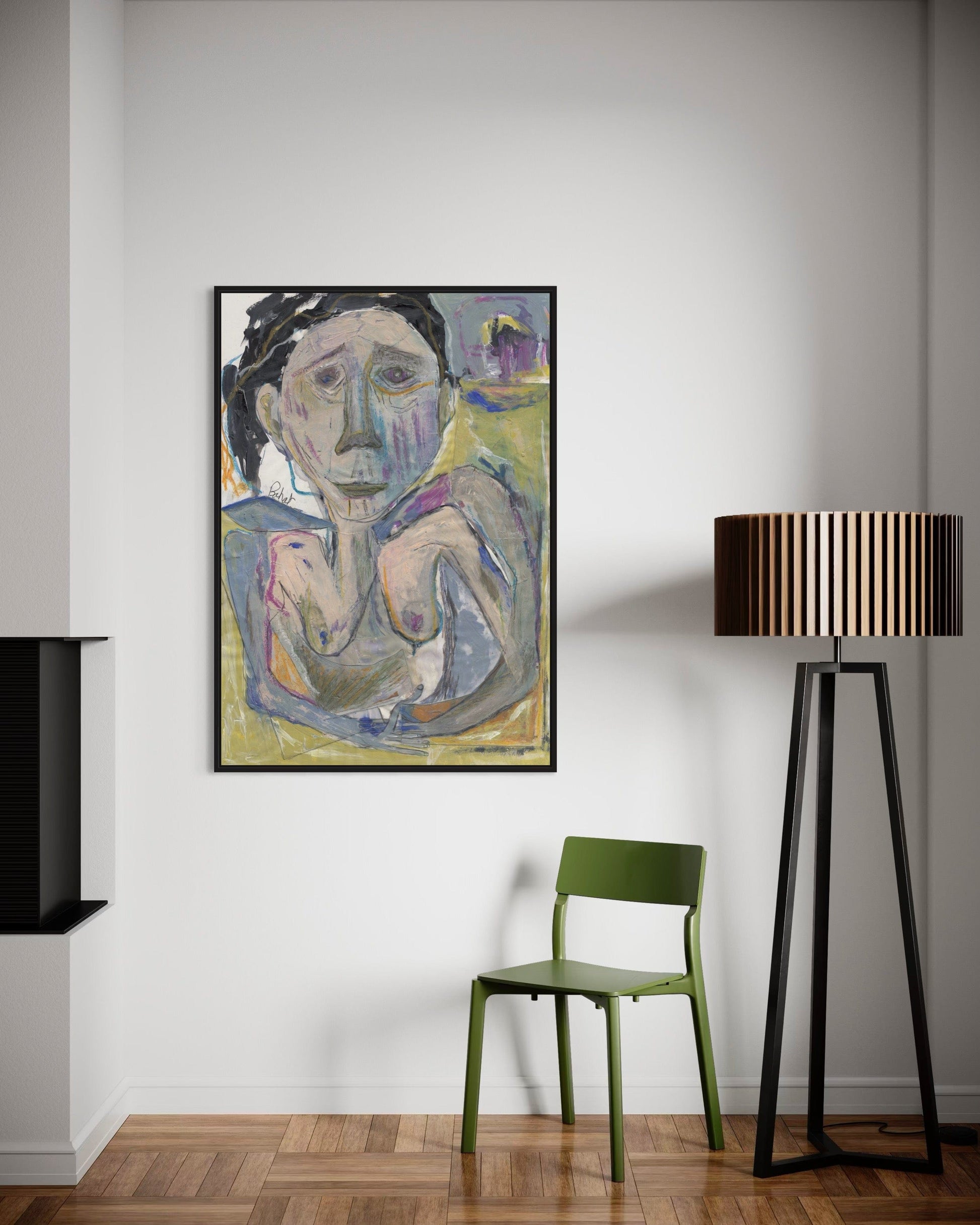 Framed abstract painting on a wall with a green chair and black floor lamp.
